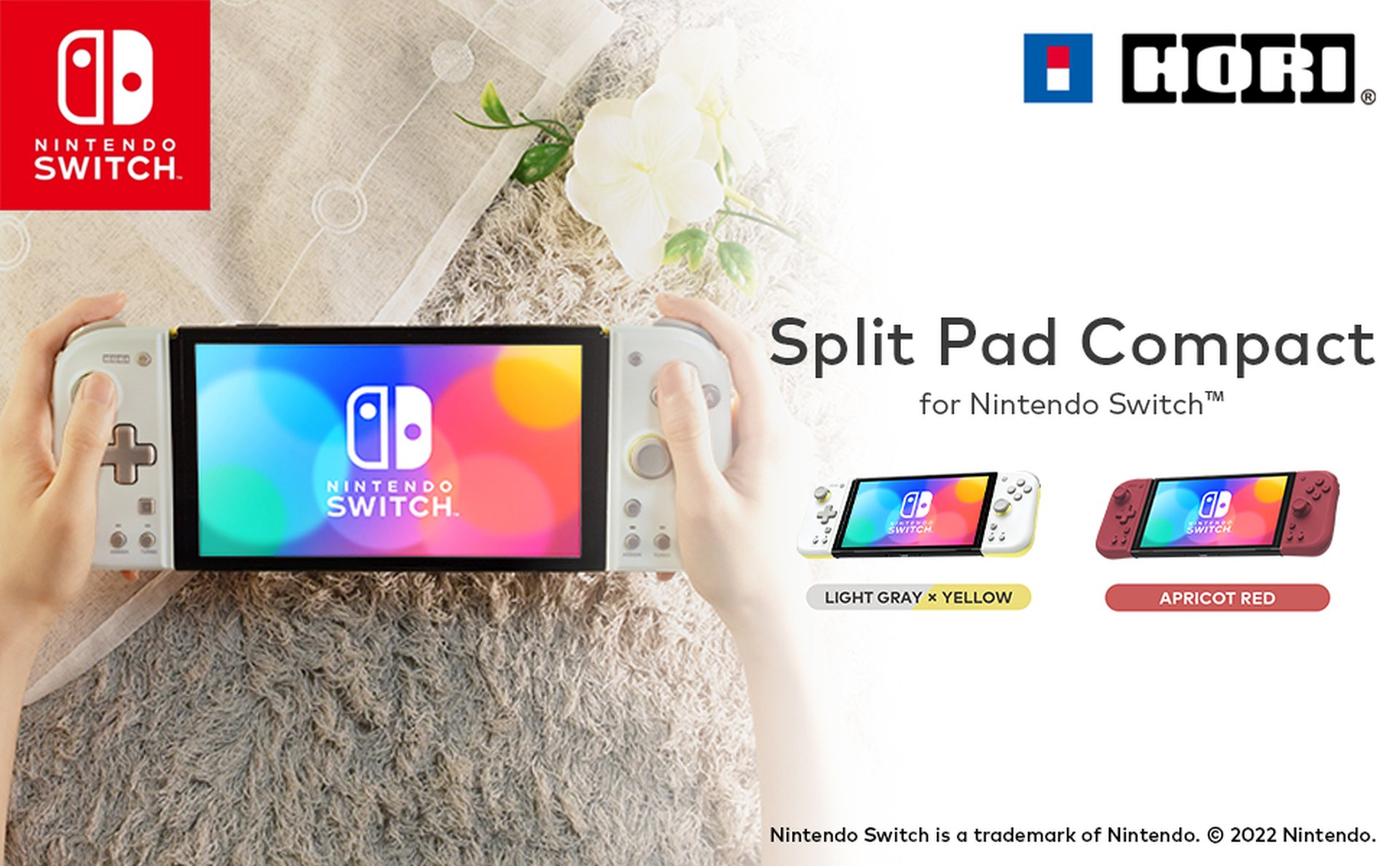 Dłonie trzymające Nintendo Switch ze Split Pad Compact w kolorze jasno szarym i żółtym.