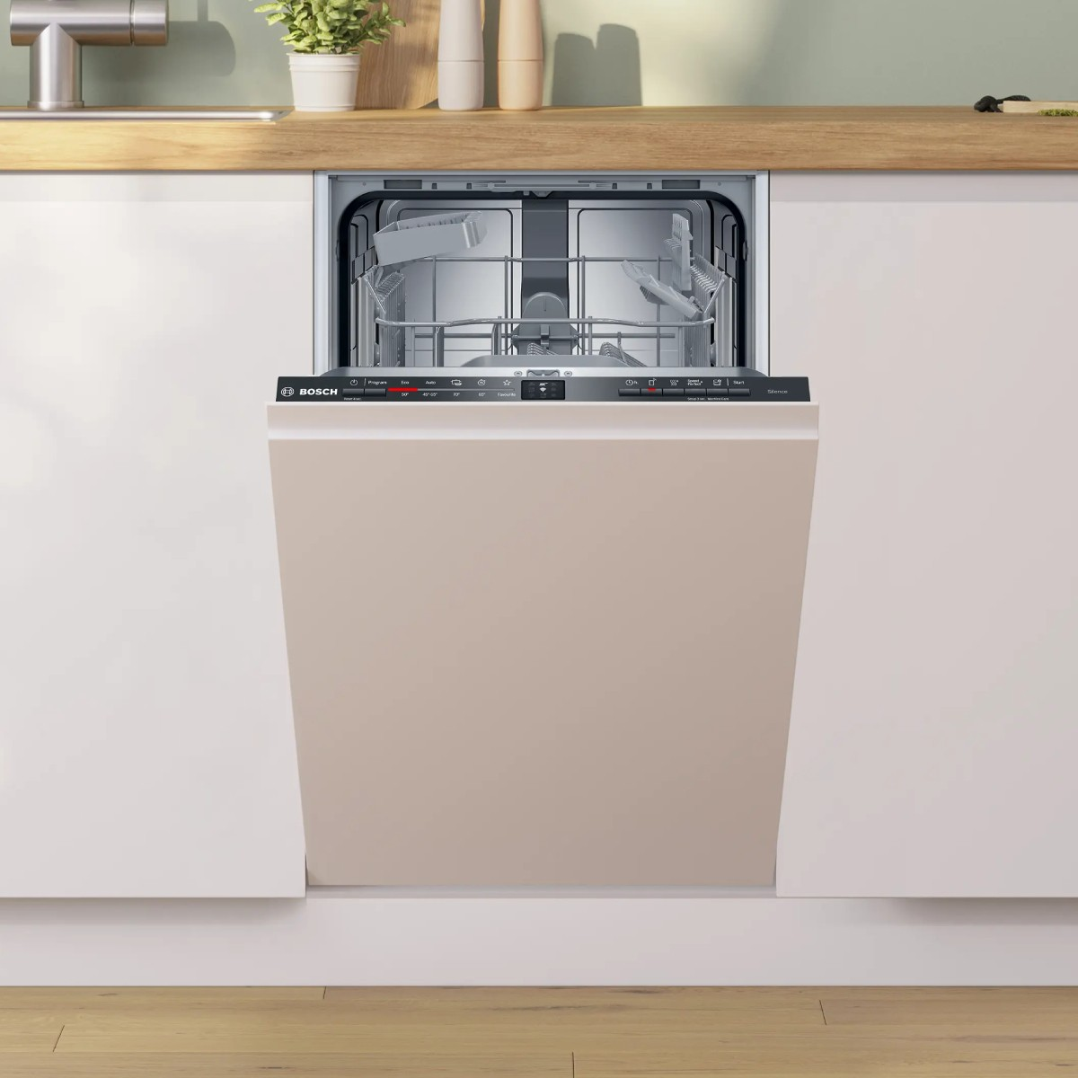 Un lavavajillas integrado con la puerta abierta, en una cocina moderna.