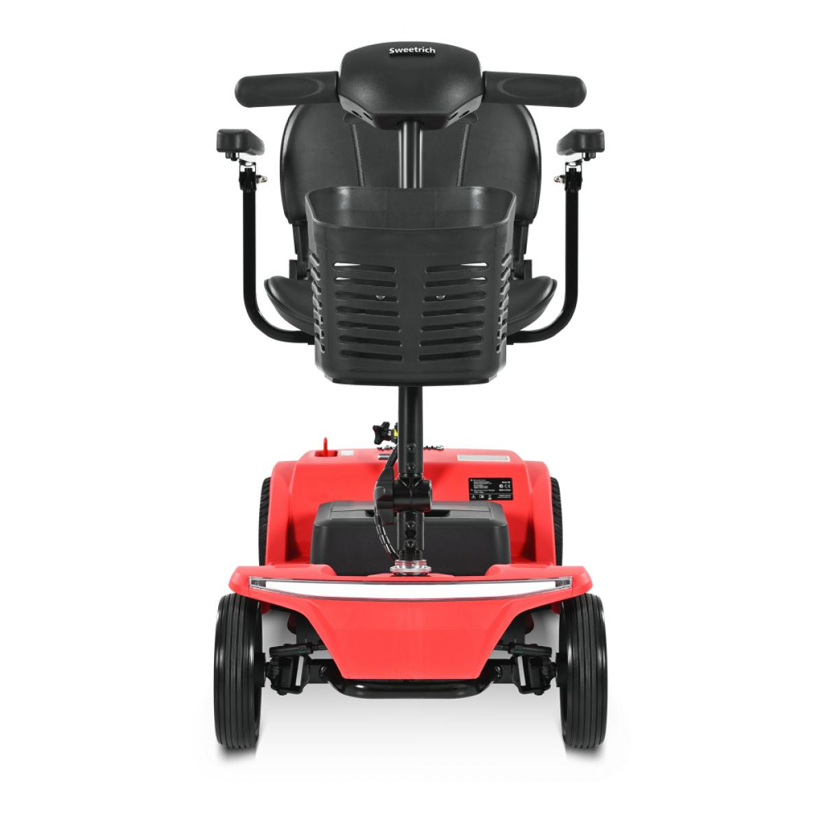 Ein roter Mobilitätsroller mit schwarzem Korb und Sitz, von vorne gesehen.