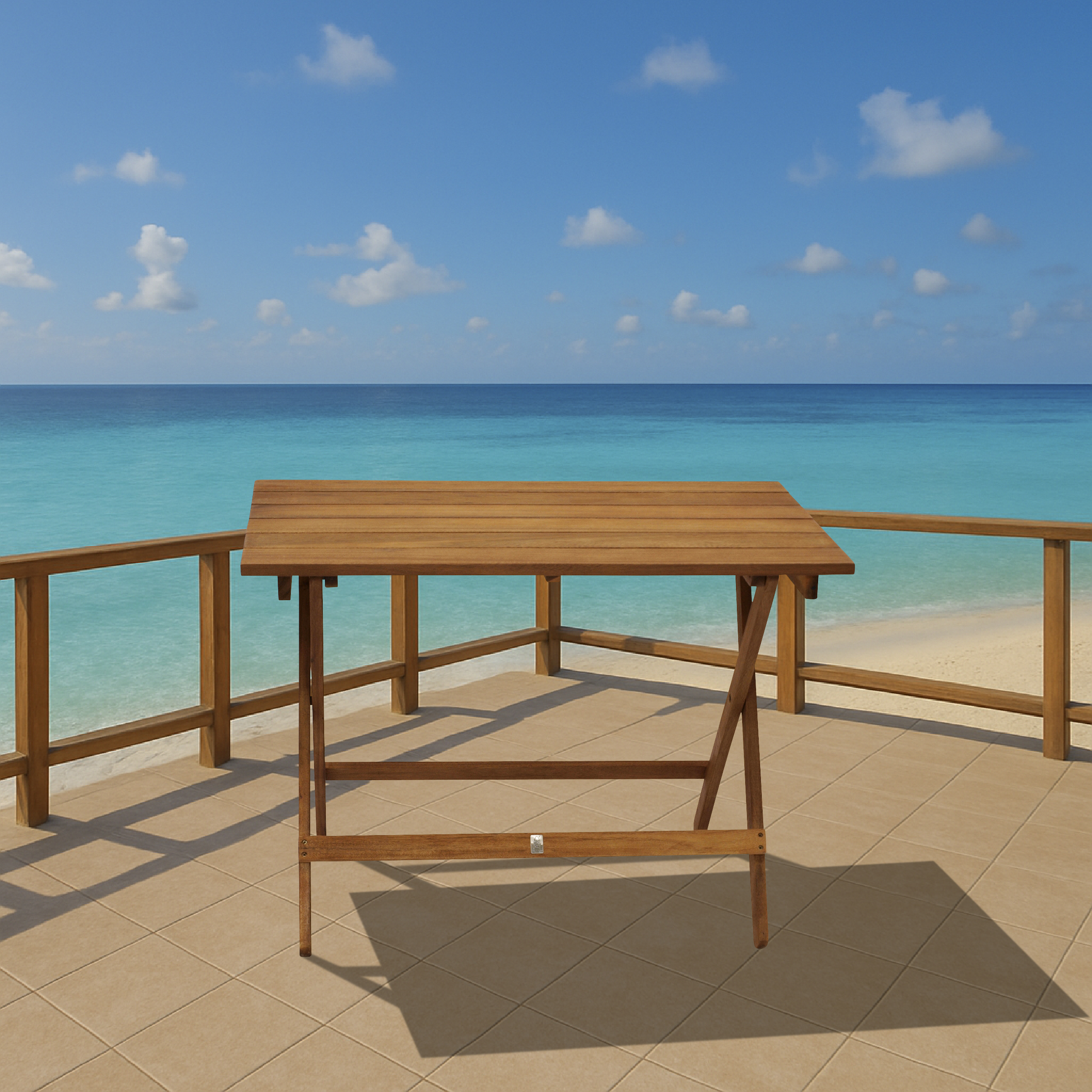 Ein Holztisch steht auf einer gefliesten Terrasse am Meer.