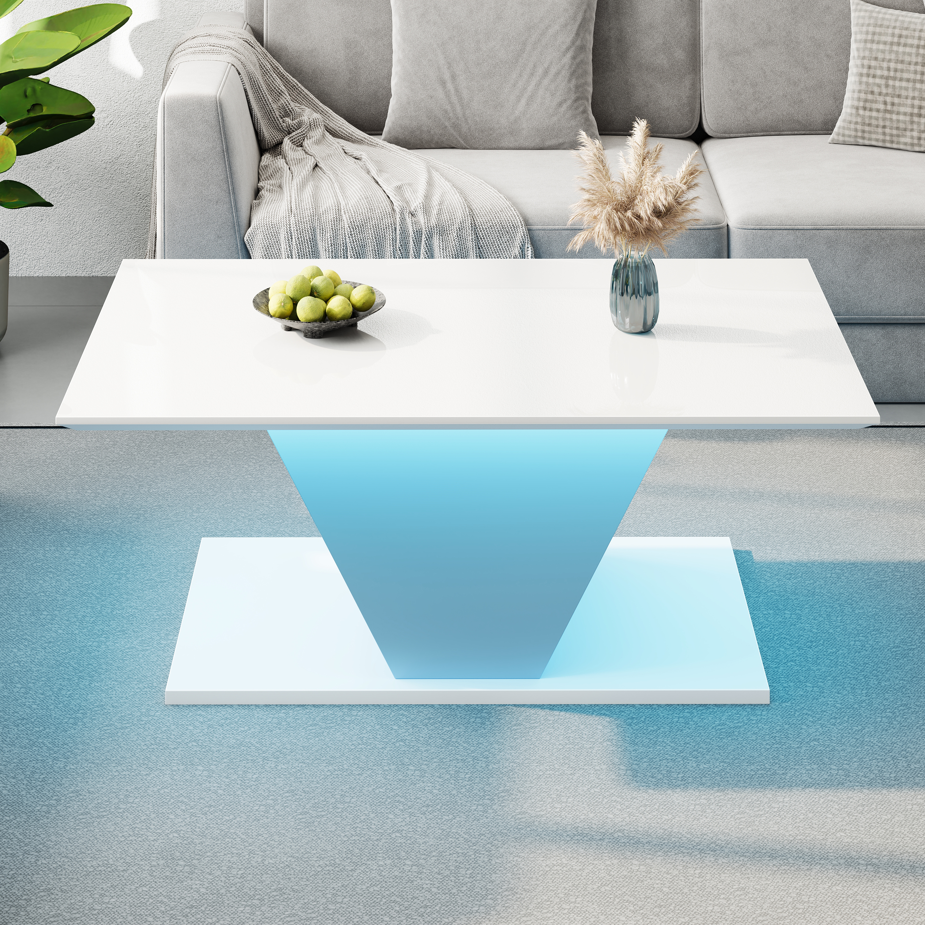 Moderner weißer Couchtisch mit blauer LED-Beleuchtung, Obstschale und Vase.