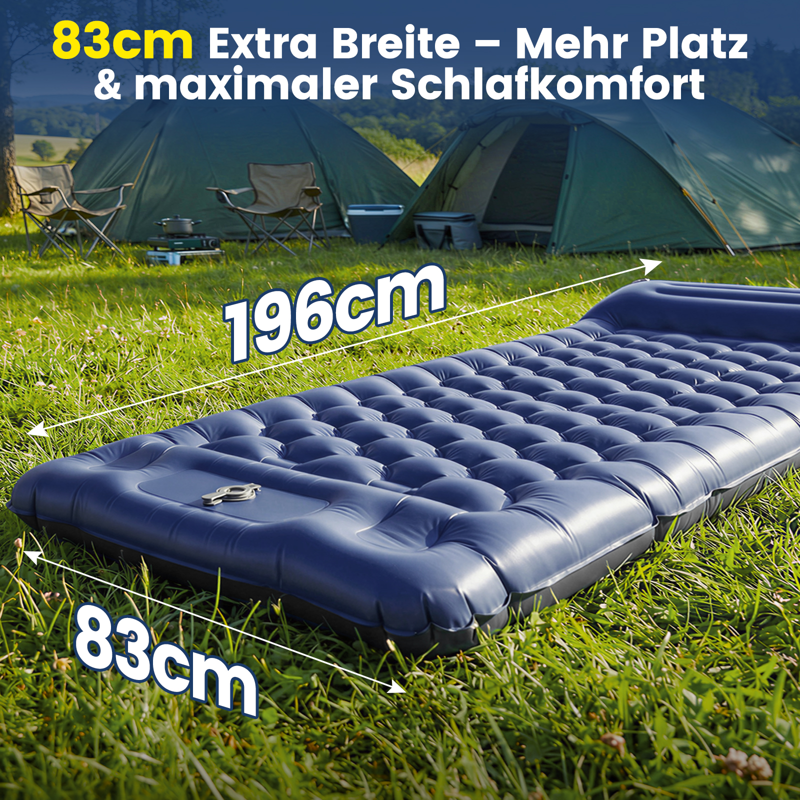 Aufblasbare Matratze (196x83cm) im Gras, Zelte im Hintergrund.