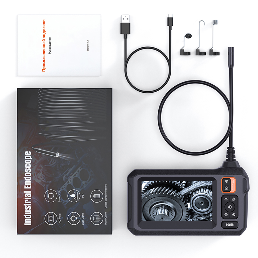 Endoskop-Kit mit Bildschirm, Kabel, Anleitung und Zubehör auf weißem Hintergrund.