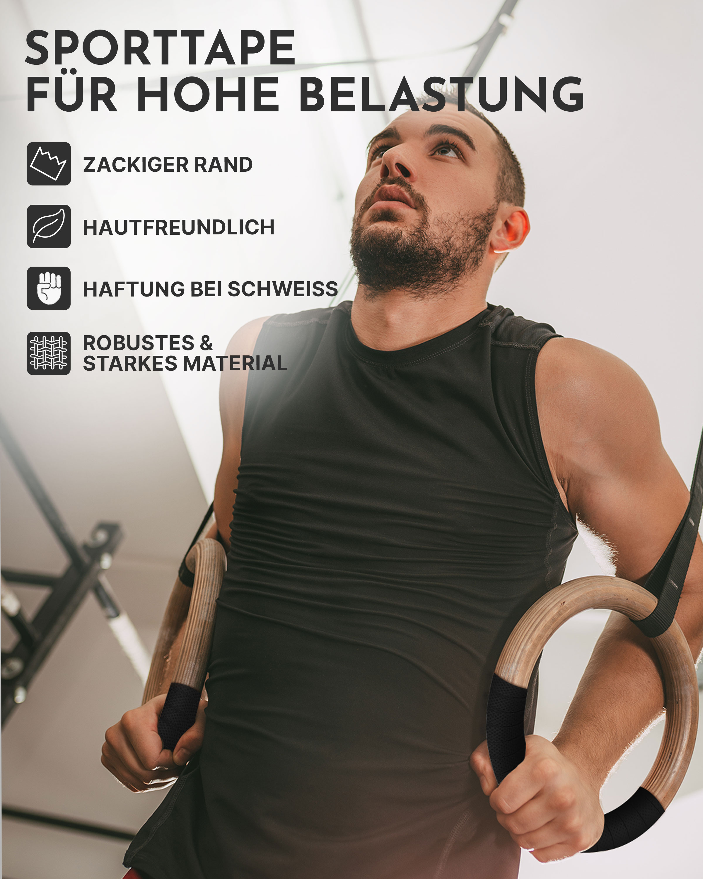 Ein Mann mit Bart hält Gymnastikringe mit Sporttape.