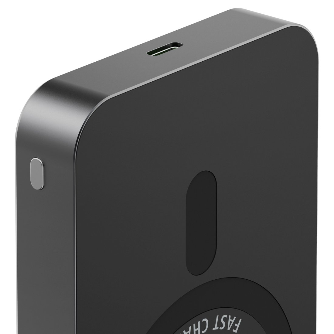Zbliżenie czarnego urządzenia ładującego z portem USB i srebrnym przyciskiem.