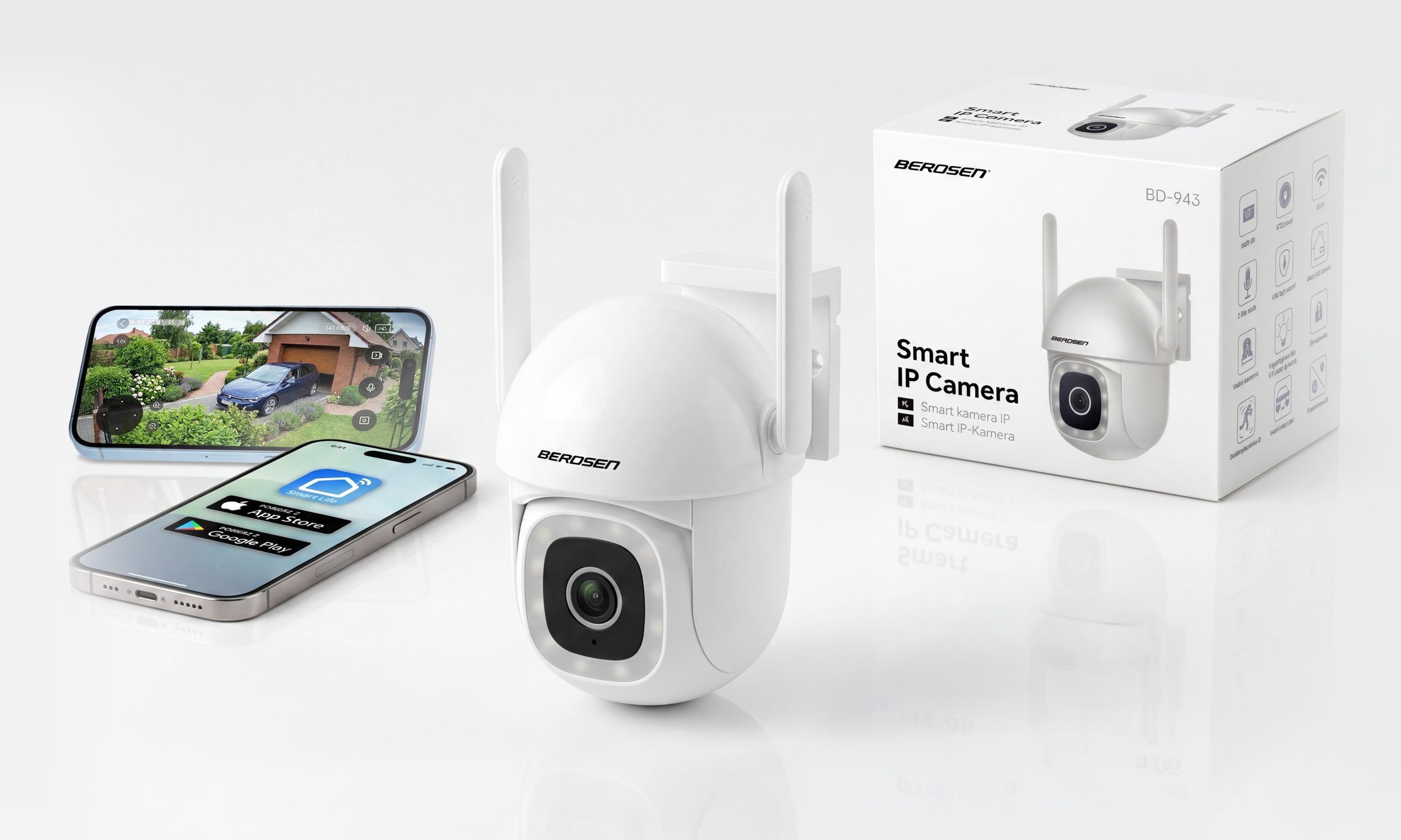 Biała kamera IP, smartfon z aplikacją i pudełko produktu na białym tle.
