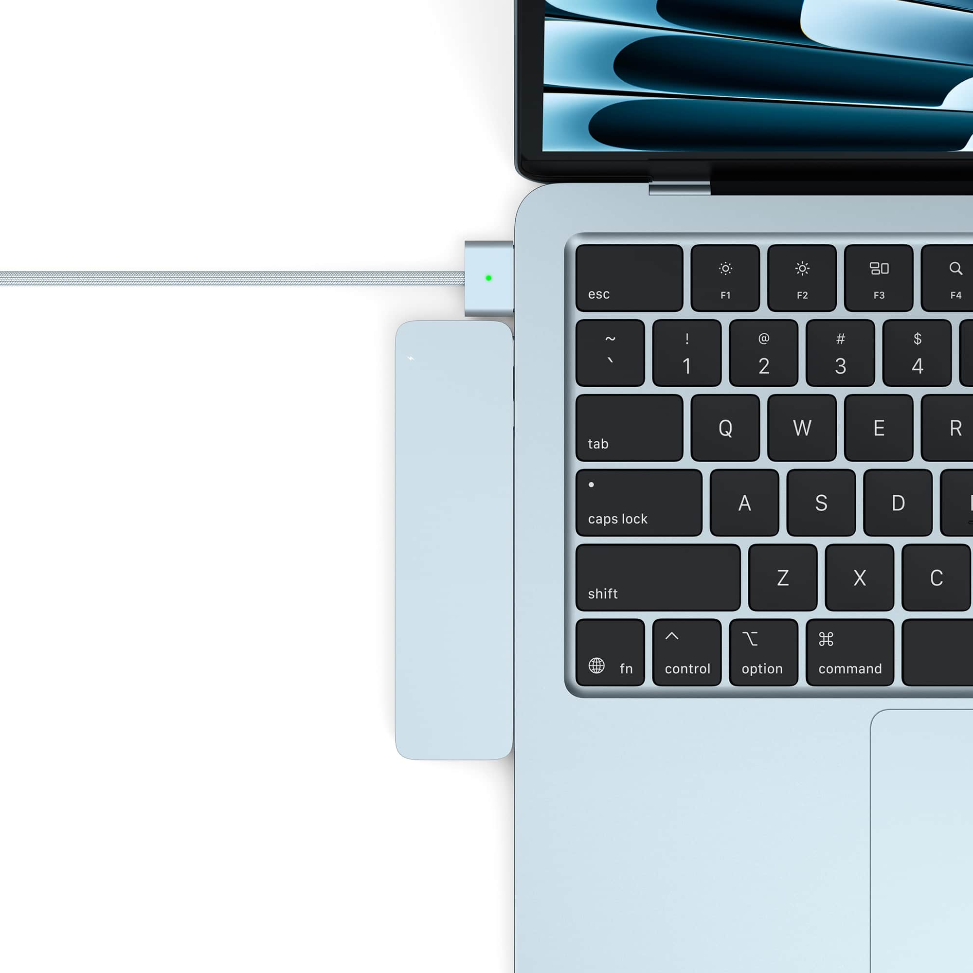 A light blue MacBook is connected to a white USB-C hub.