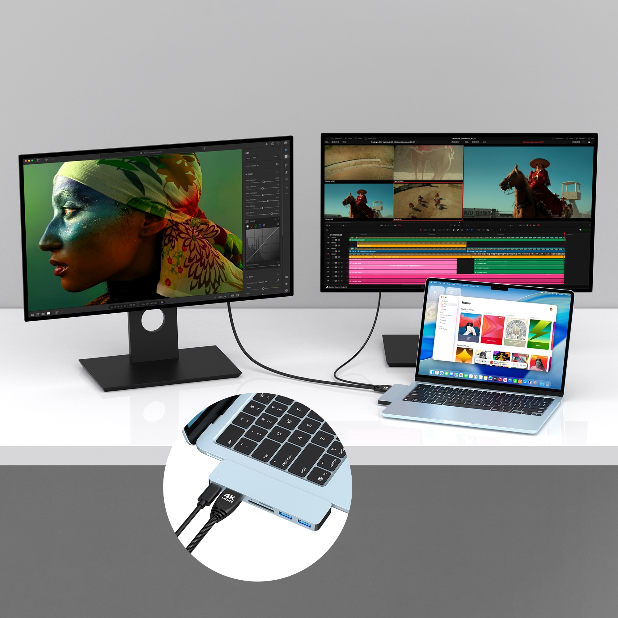 Dual monitors and laptop display editing software. Close-up of hub connected to laptop.