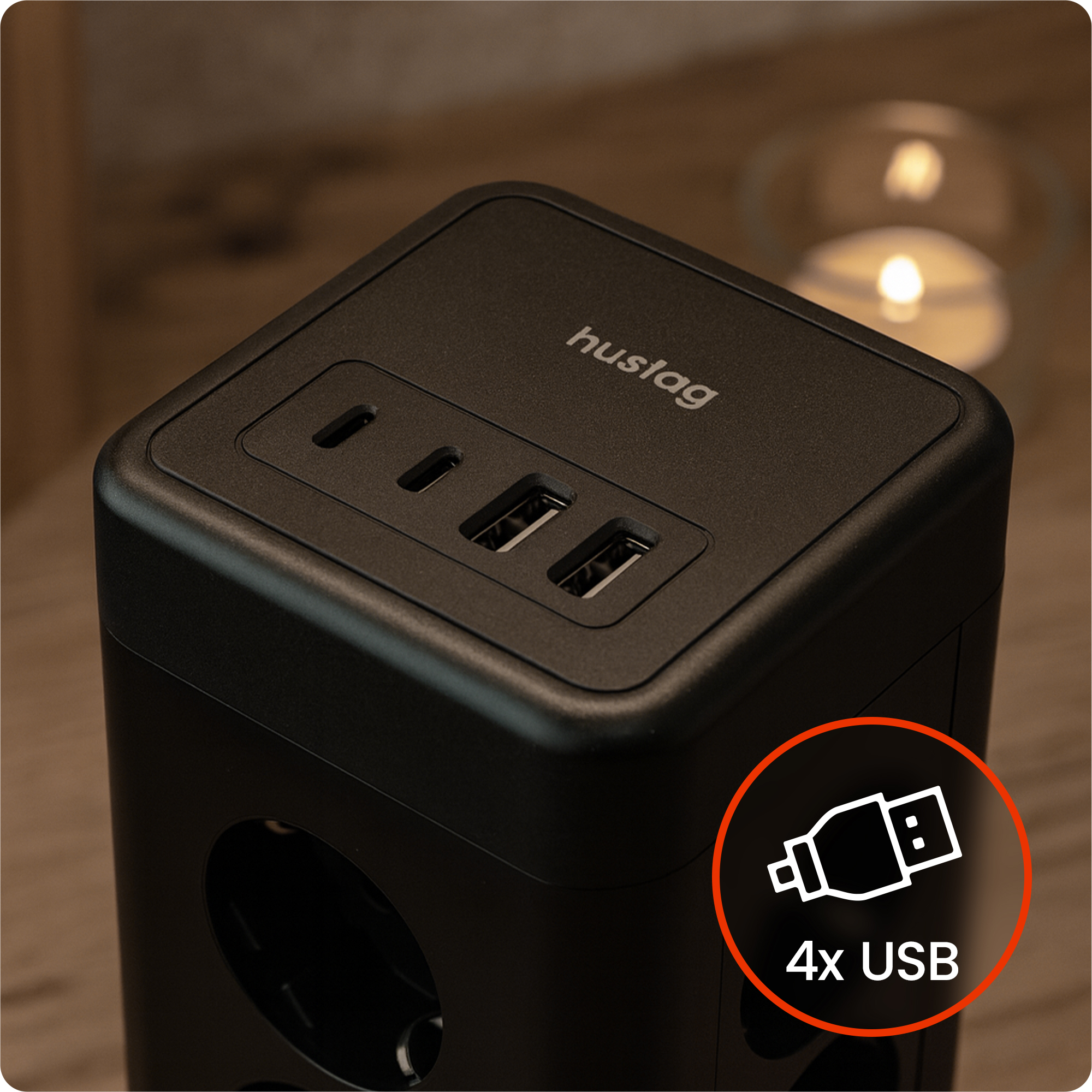 Czarny adapter sześcienny z 3 portami USB na górze i gniazdami po bokach.