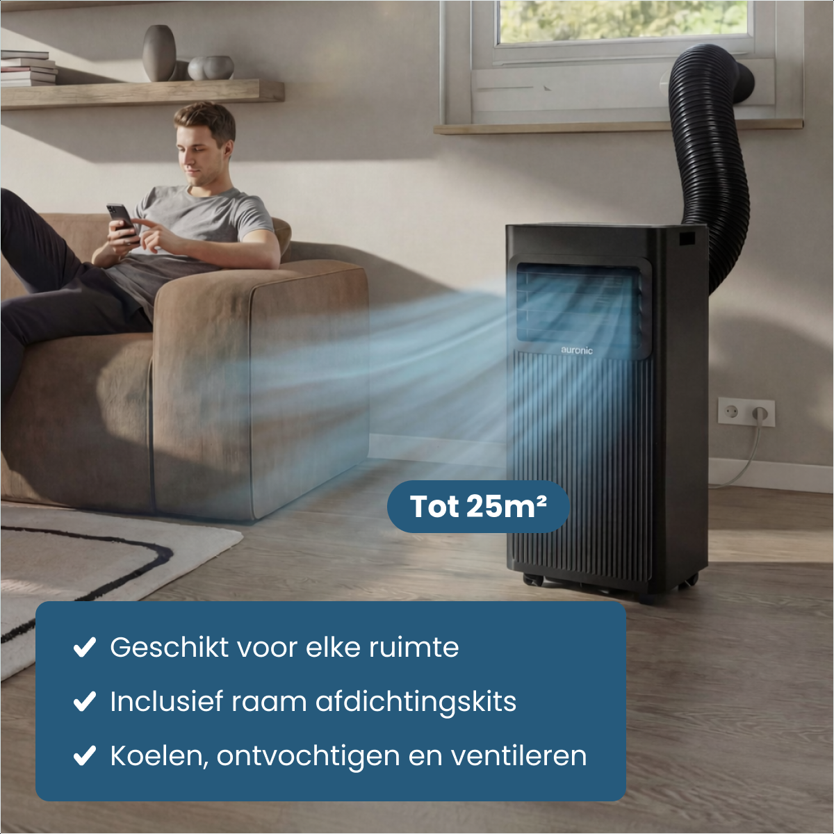 Man on sofa, portable AC unit blows cool air. Suitable for up to 25m².