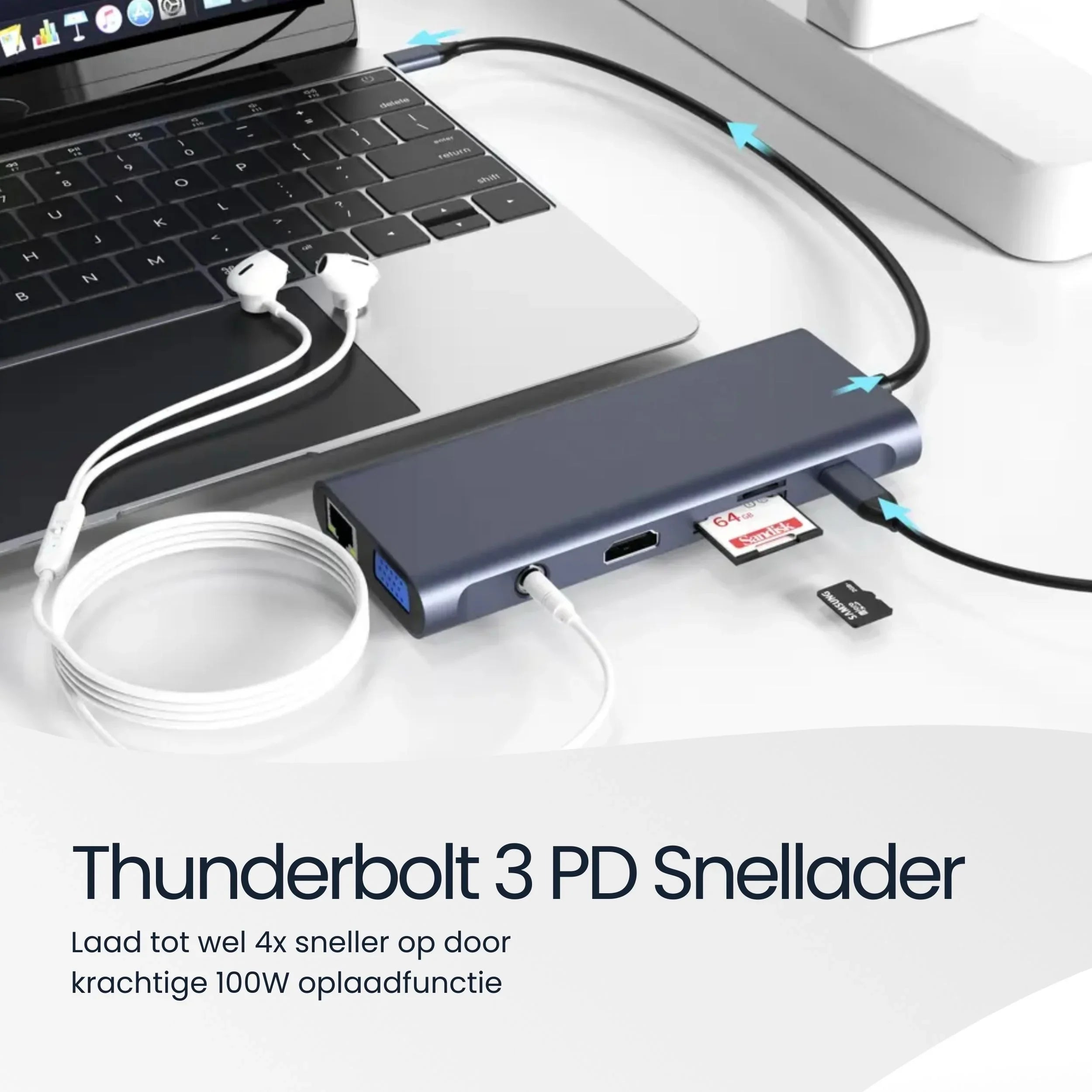 A grey USB-C hub is connected to a laptop. Earphones are nearby.