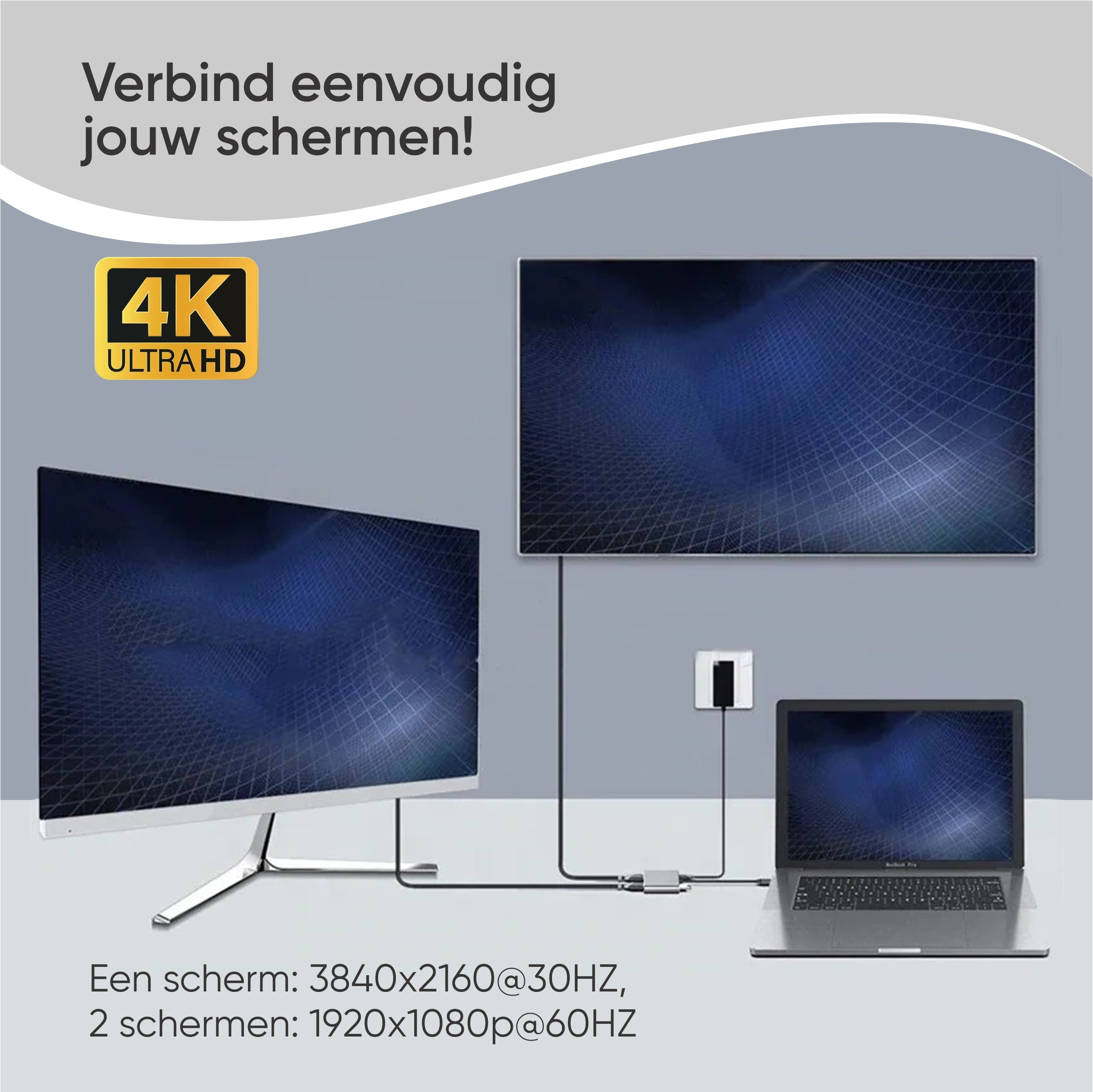A laptop connects two 4K monitors via an adapter.