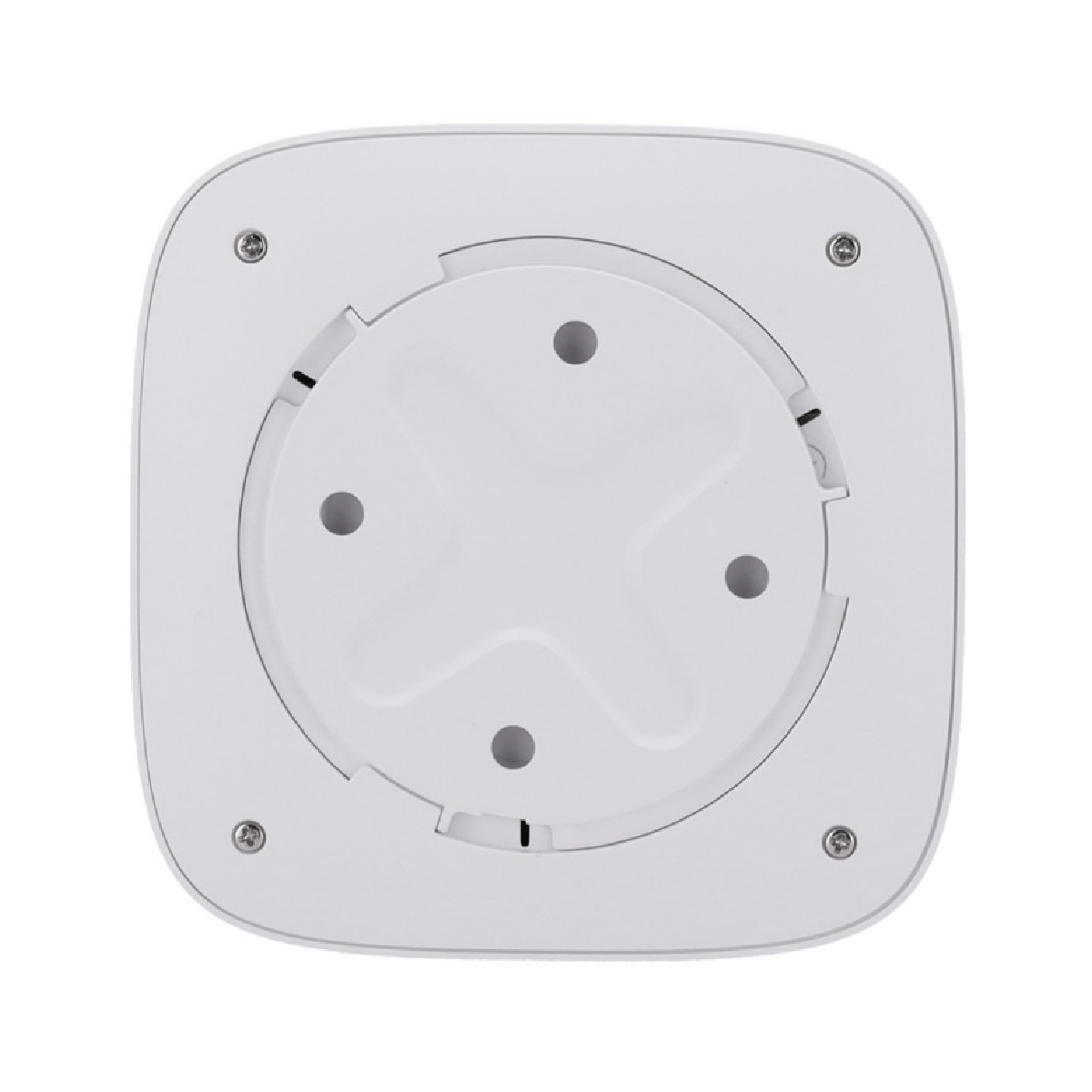 Parte inferior de un dispositivo cuadrado blanco con cuatro tornillos y rejillas de ventilación.