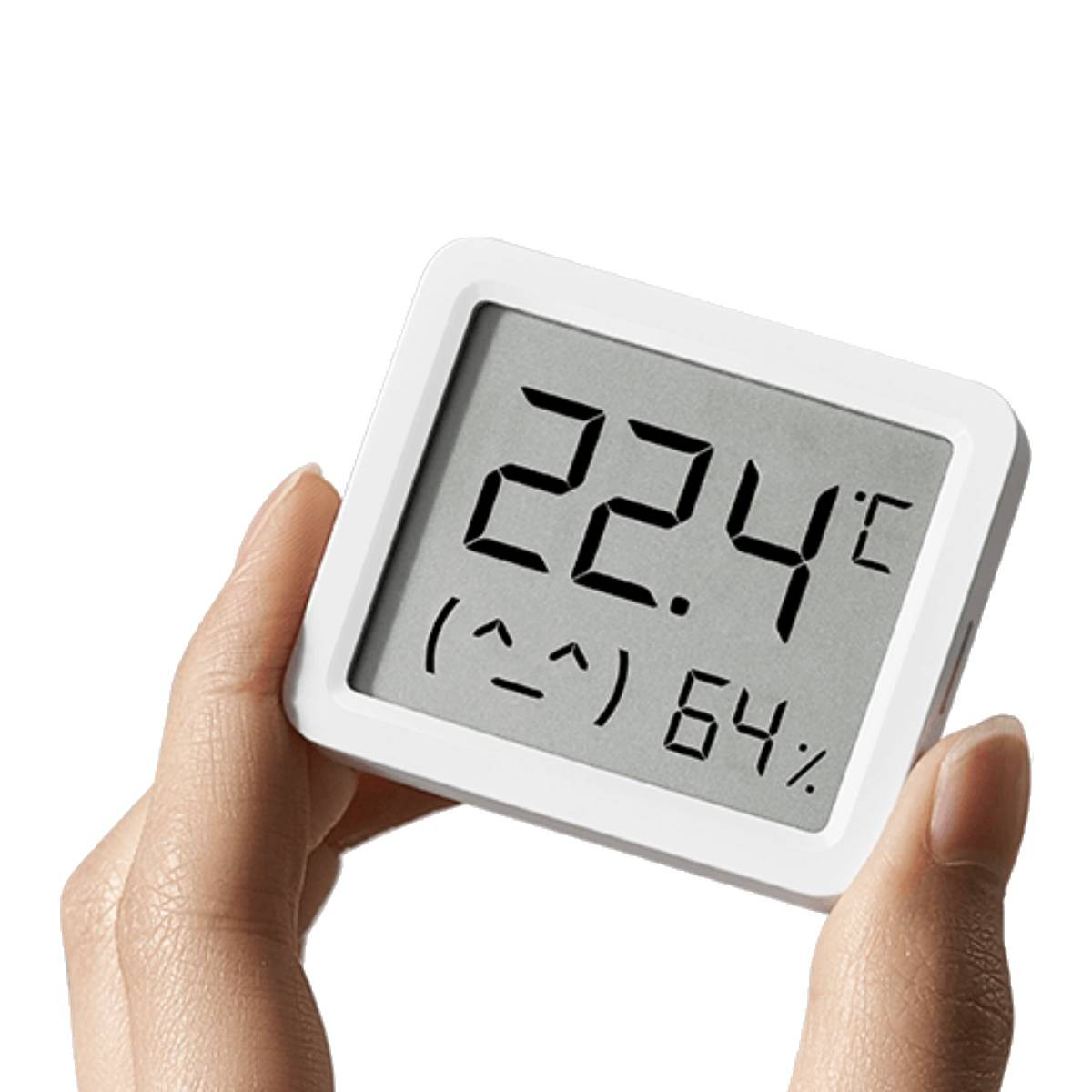 Un termometro digitale bianco mostra 22,4 gradi Celsius e 64% di umidità.