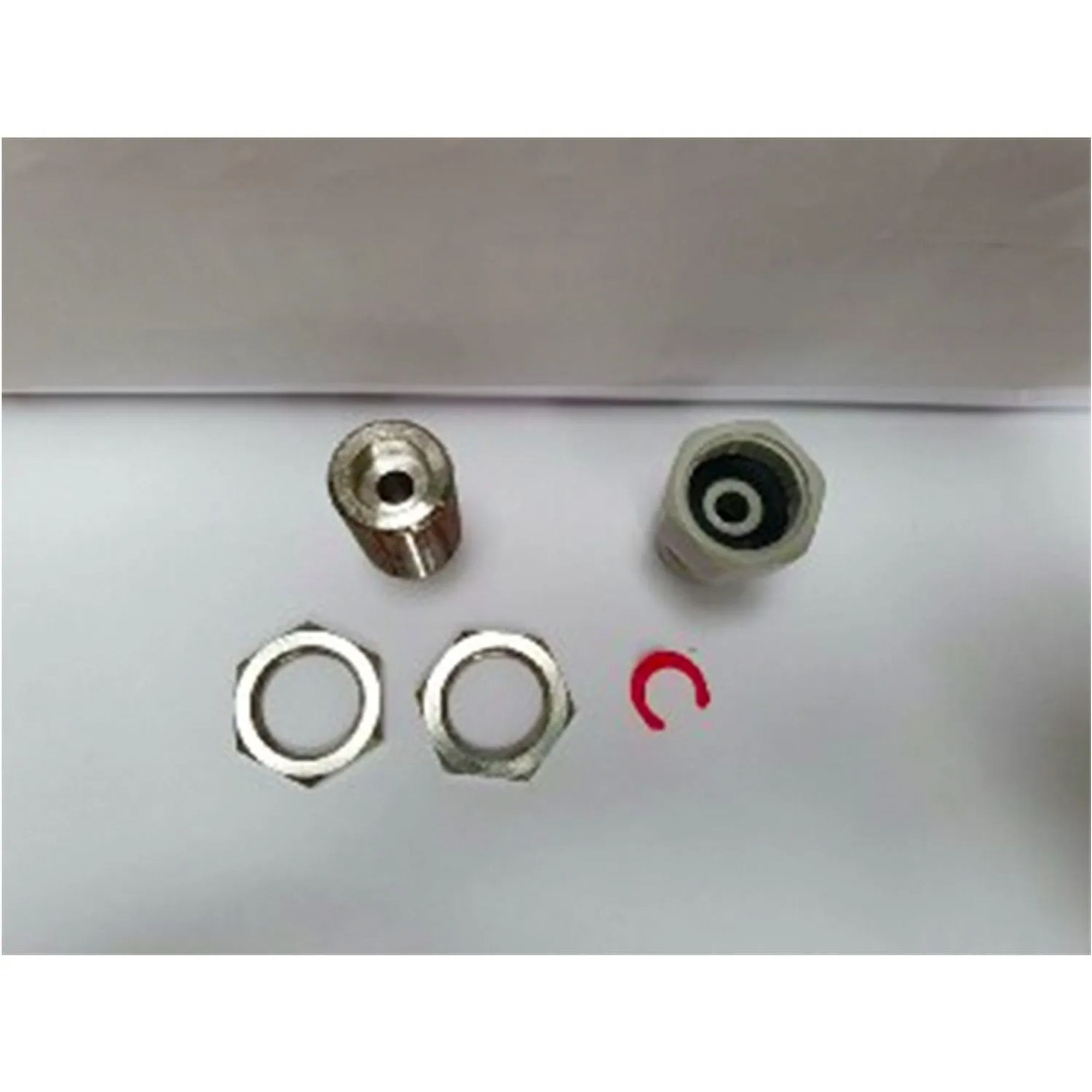 Metal parts: two nuts, a threaded adapter, a connector, and a red clip.