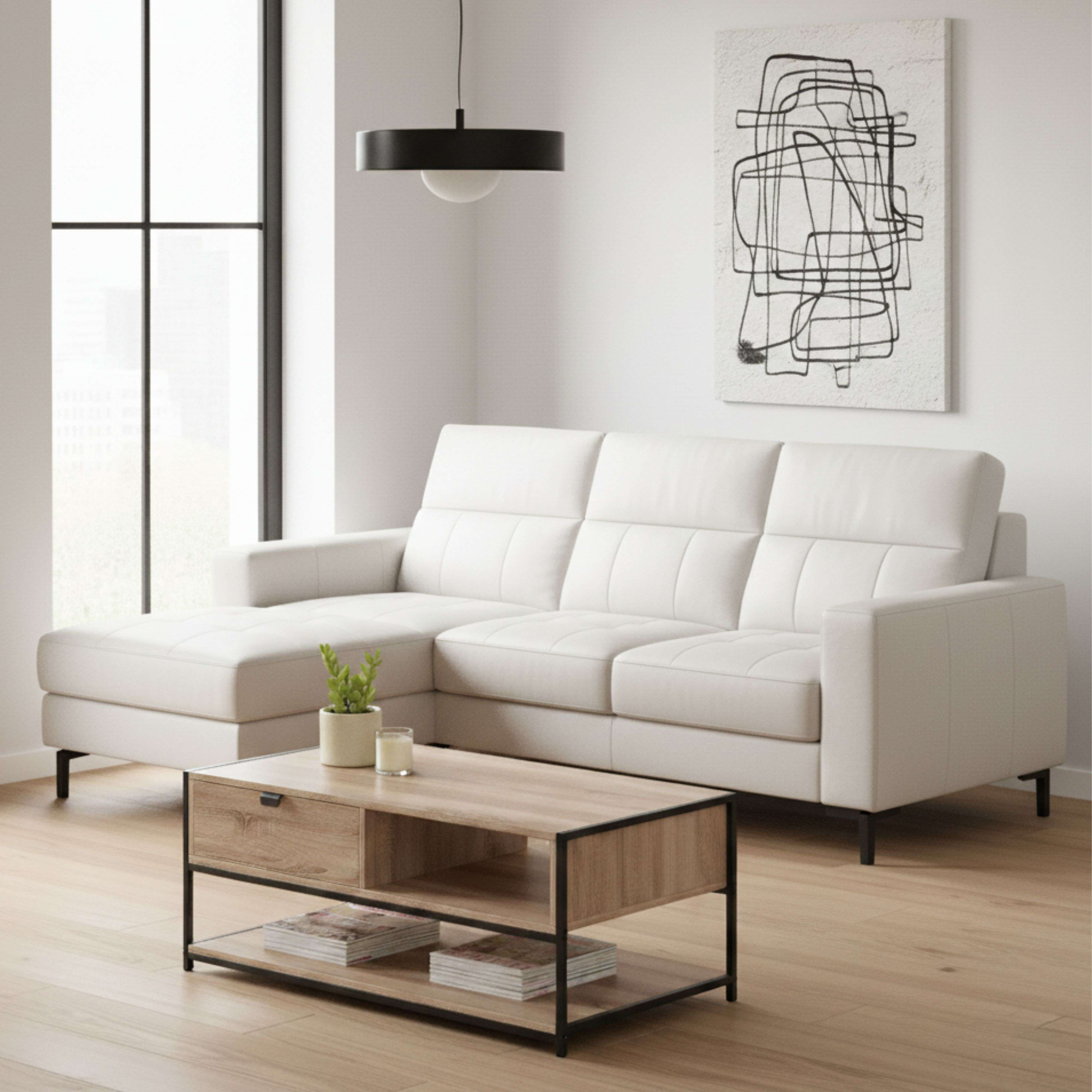 Sala de estar moderna con sofá seccional blanco, mesa de centro y arte abstracto.