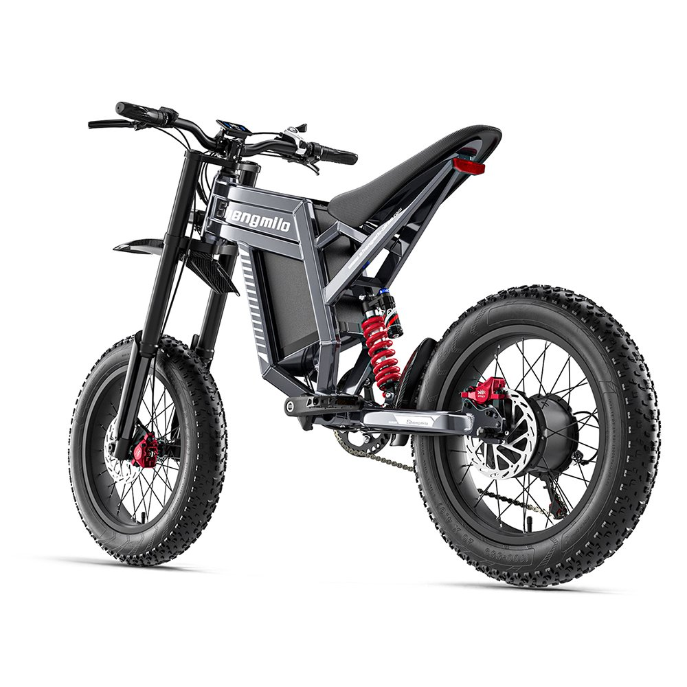Una bicicleta eléctrica gris con neumáticos anchos, amortiguadores rojos y asiento negro.
