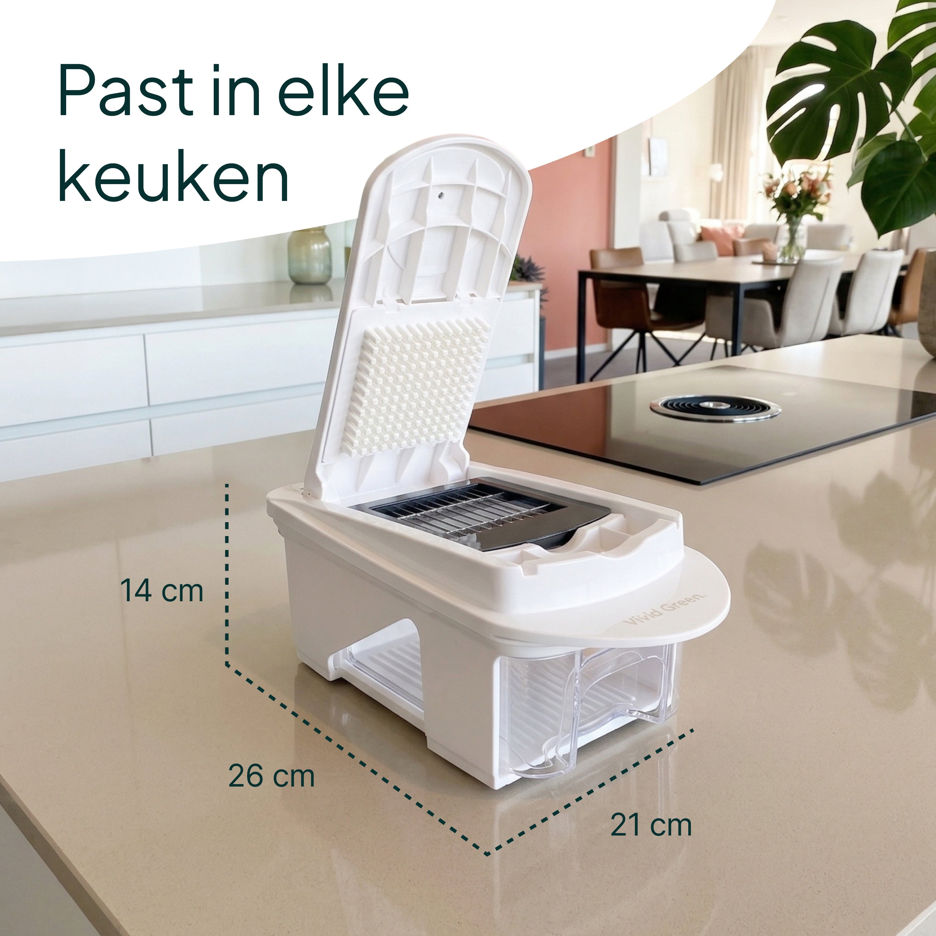 A white kitchen slicer with a container, 26x21x14cm, sits on a countertop.