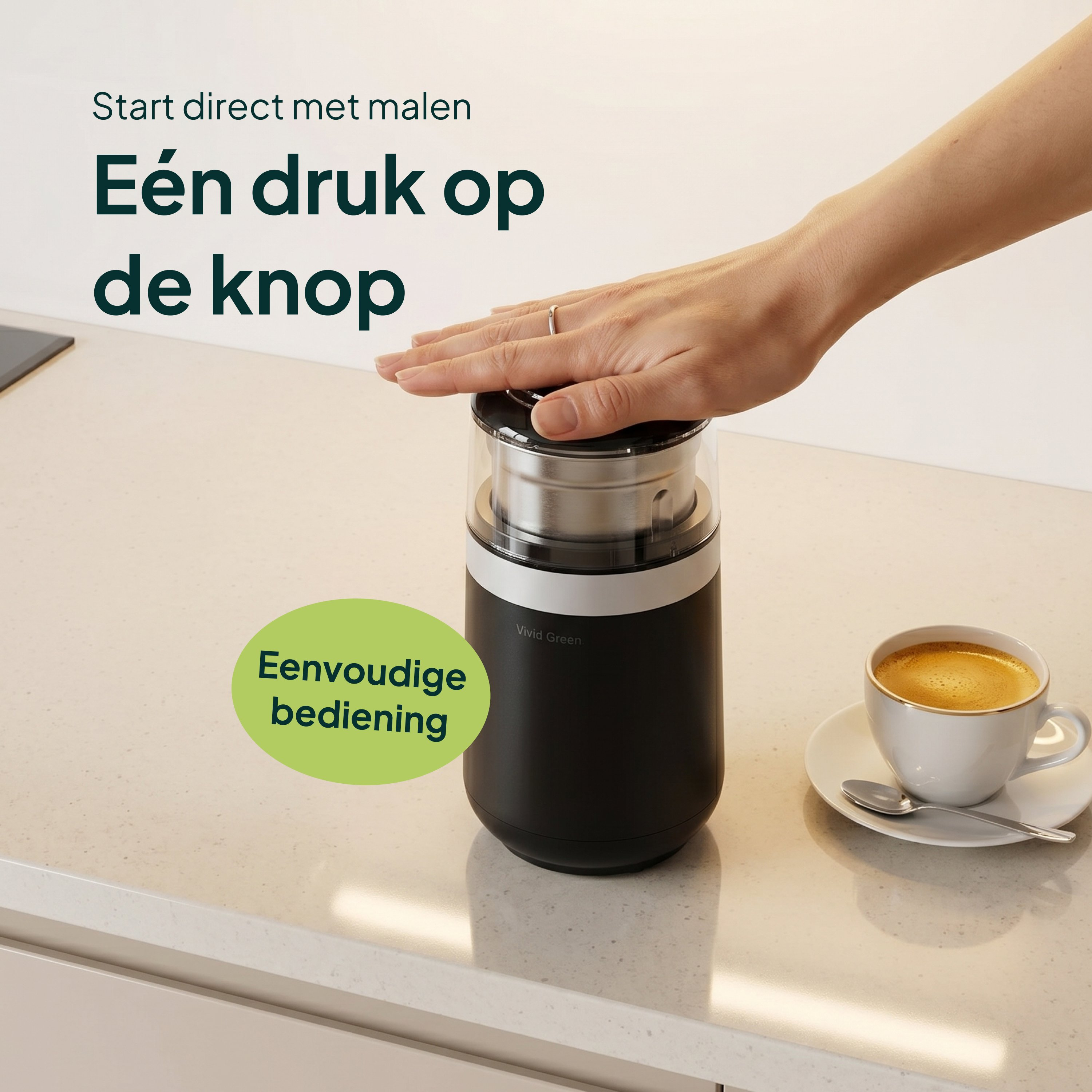 A black coffee grinder with a cup of coffee next to it.