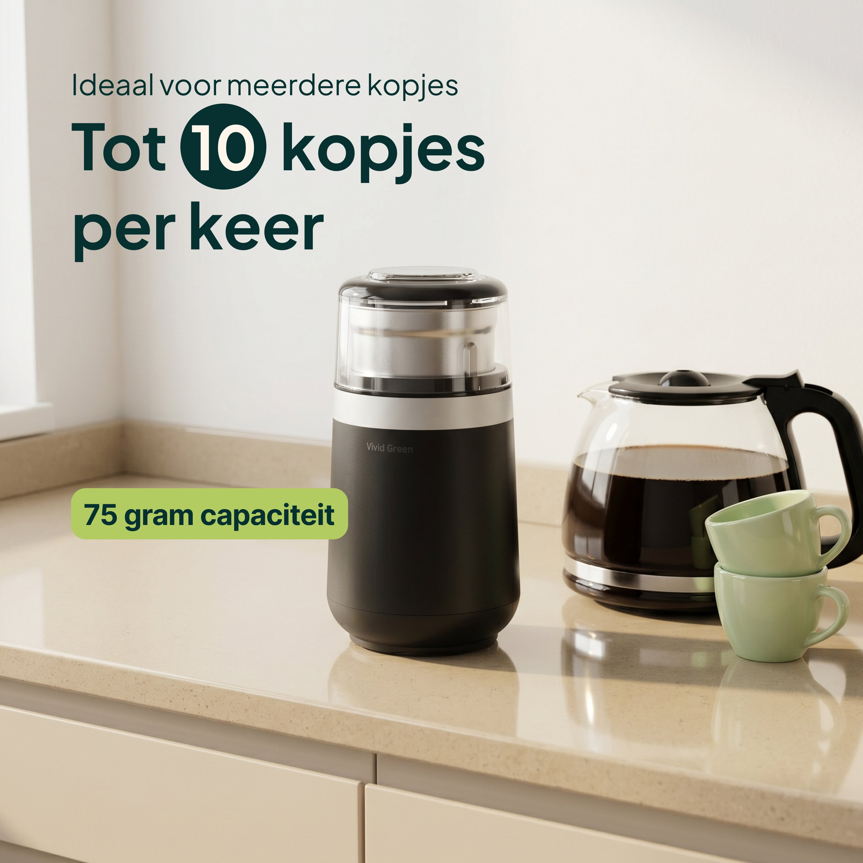 A coffee grinder with 75g capacity sits next to a coffee pot and two cups.