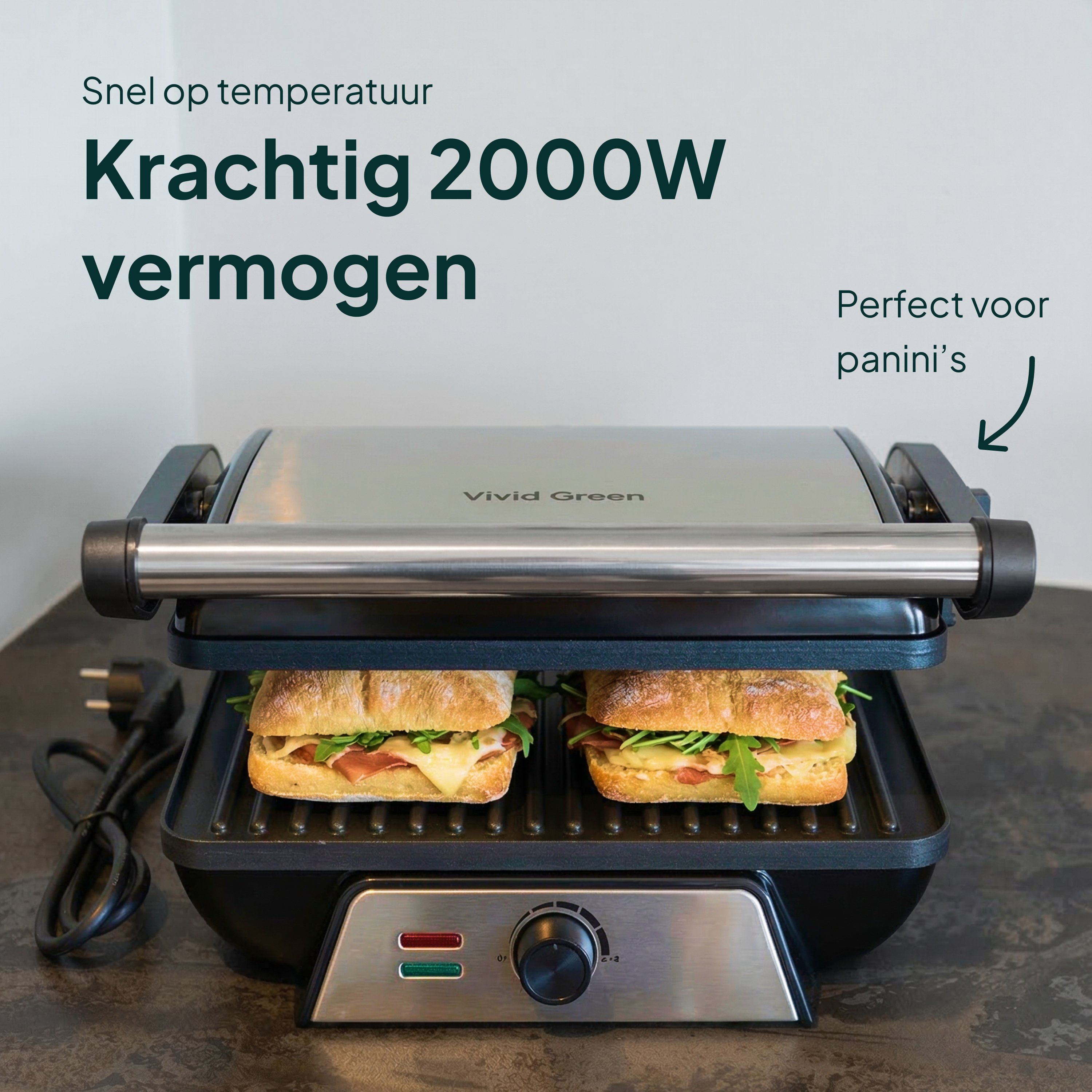 An open panini press cooking two sandwiches. Features a power dial and indicator lights.