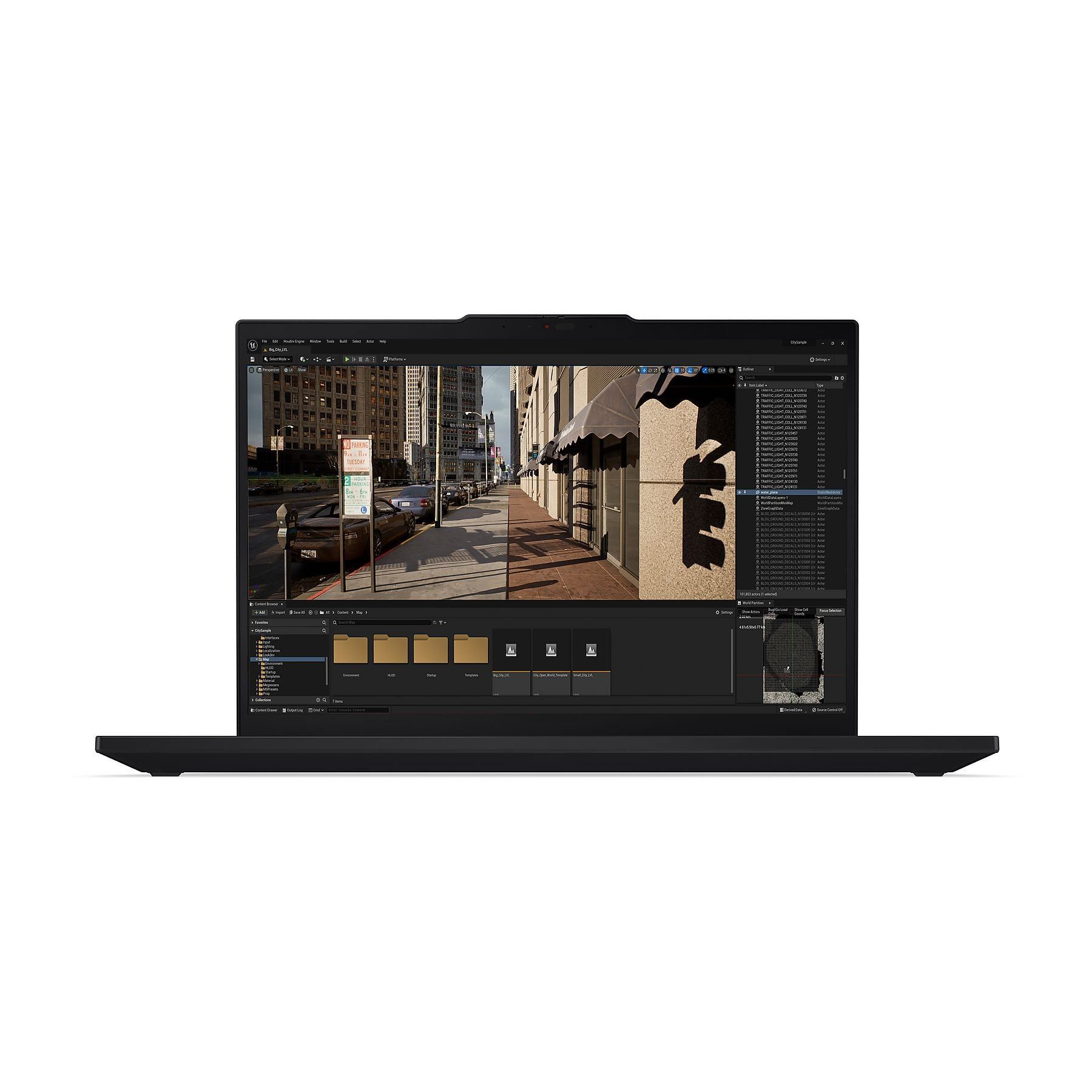 Un laptop mostra una scena cittadina con edifici e auto.