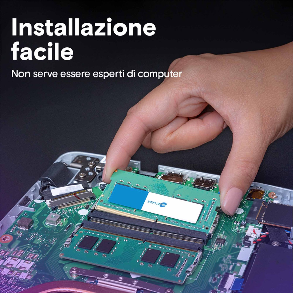A hand installs a RAM module into a laptop motherboard.