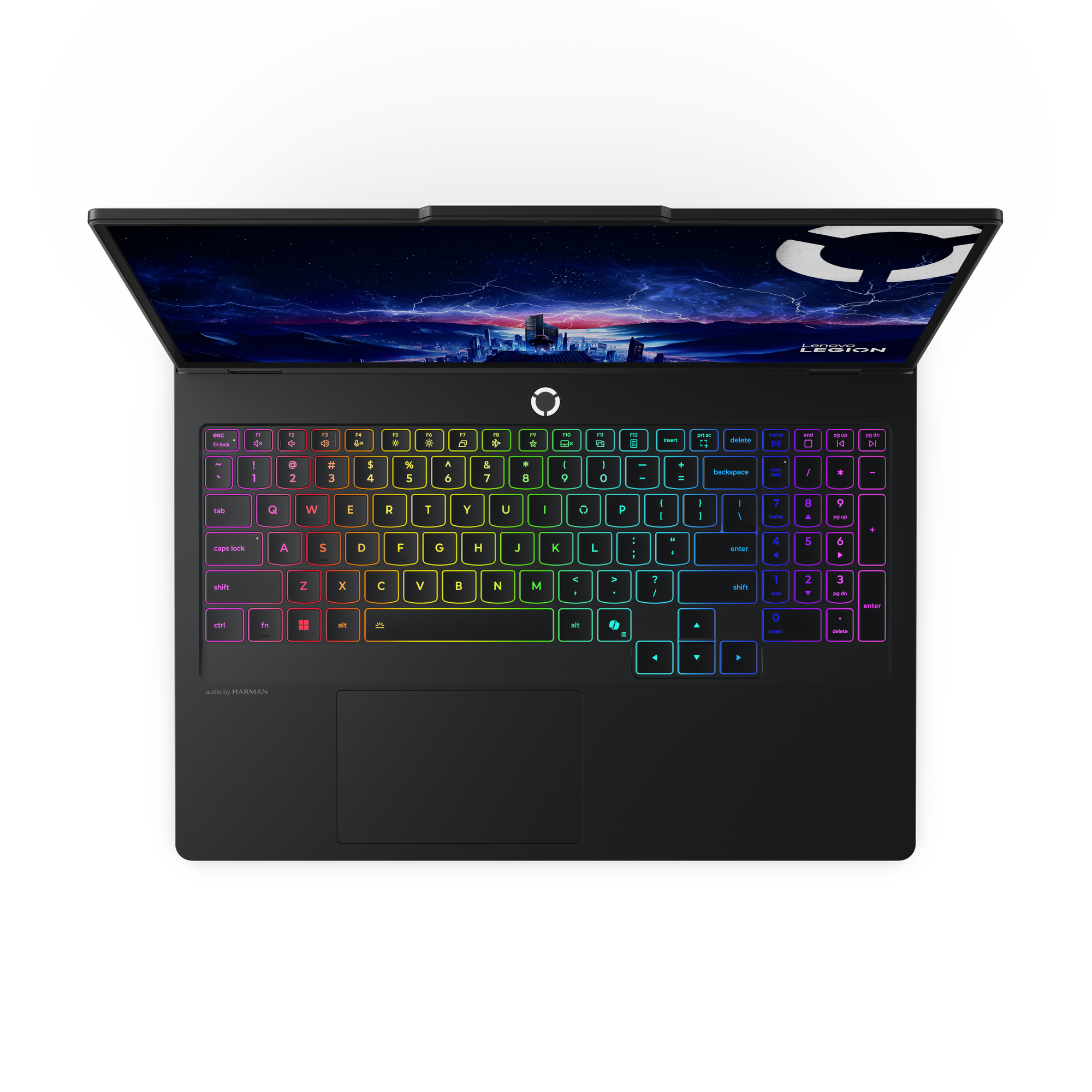 Un laptop nero con tastiera retroilluminata, con uno sfondo di skyline cittadino.