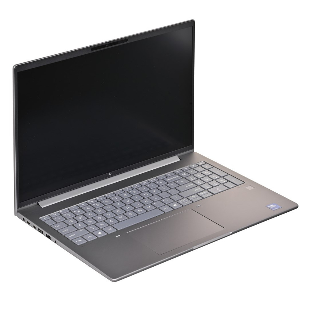 Zamknięty srebrny laptop z czarnym ekranem i klawiaturą.