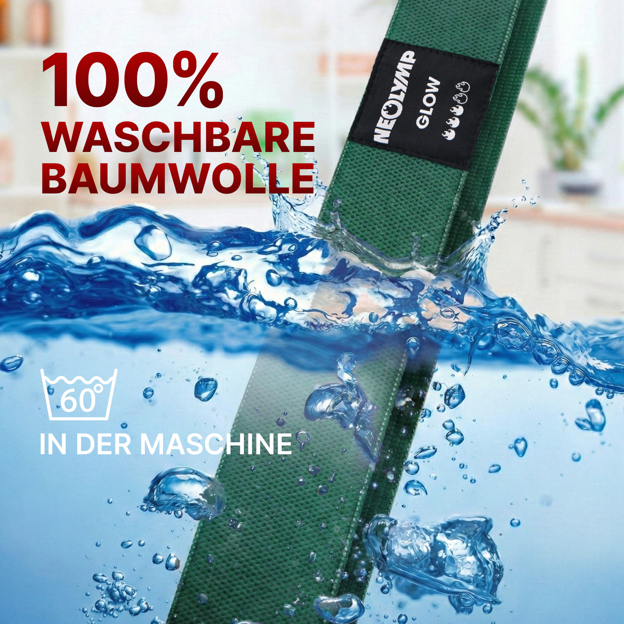 Grüner Gurt wird in Wasser getaucht. "100% Waschbare Baumwolle".