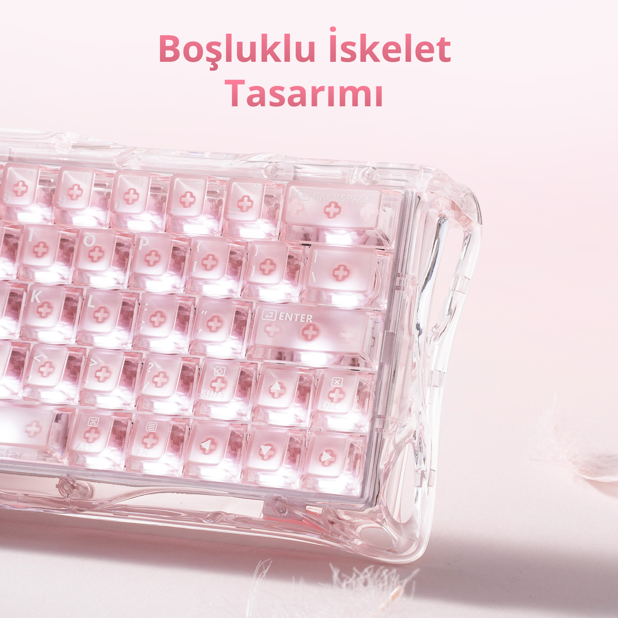 Şeffaf kasalı ve pembe tuşlu pembe bir klavye.