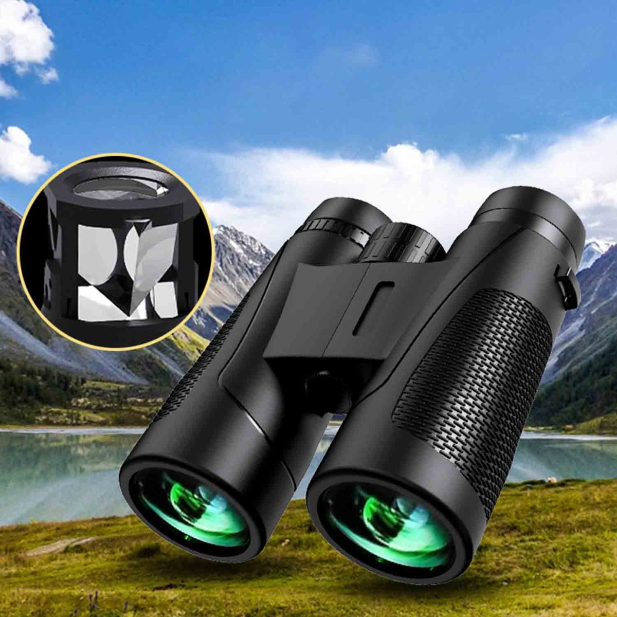 Binocolo nero con lenti verdi su uno sfondo di montagna e lago.