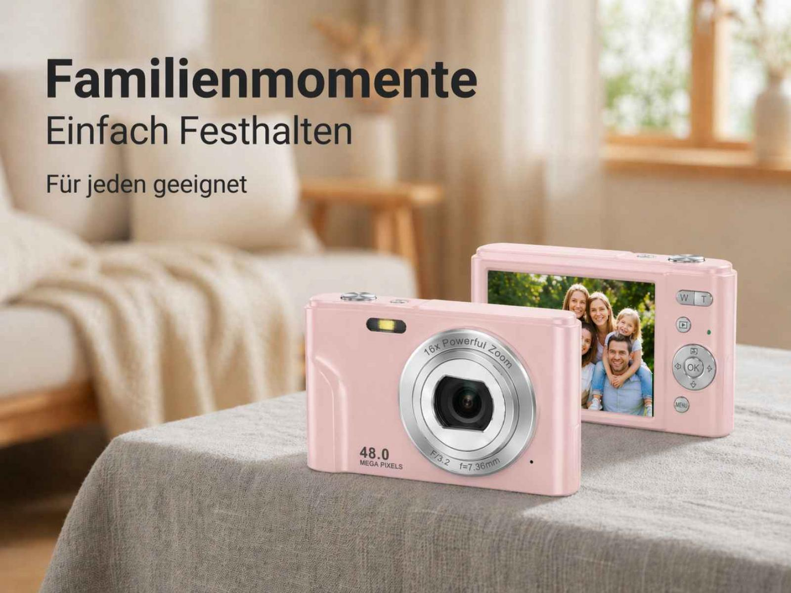 Zwei rosafarbene Digitalkameras auf einer Tischdecke, eine zeigt ein Familienfoto.
