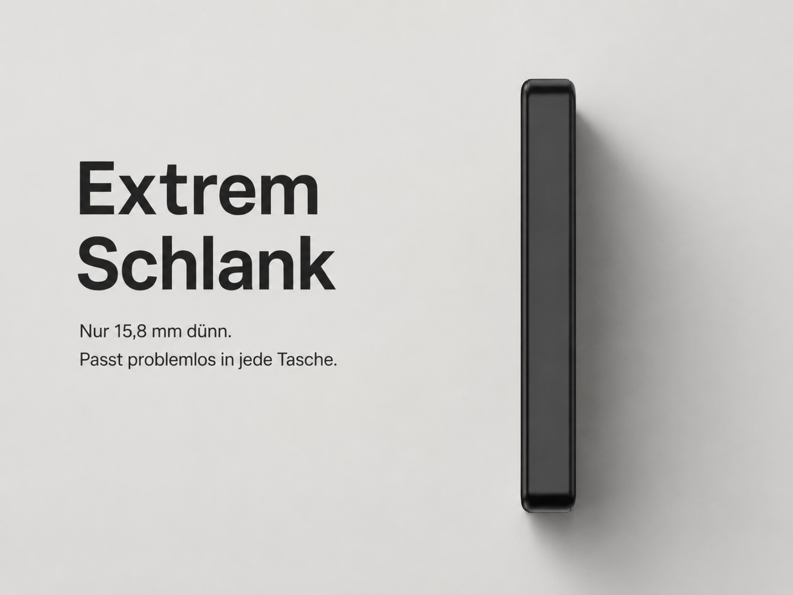 Ein schlankes, schwarzes Objekt liegt auf hellem Grund. "Extrem Schlank".