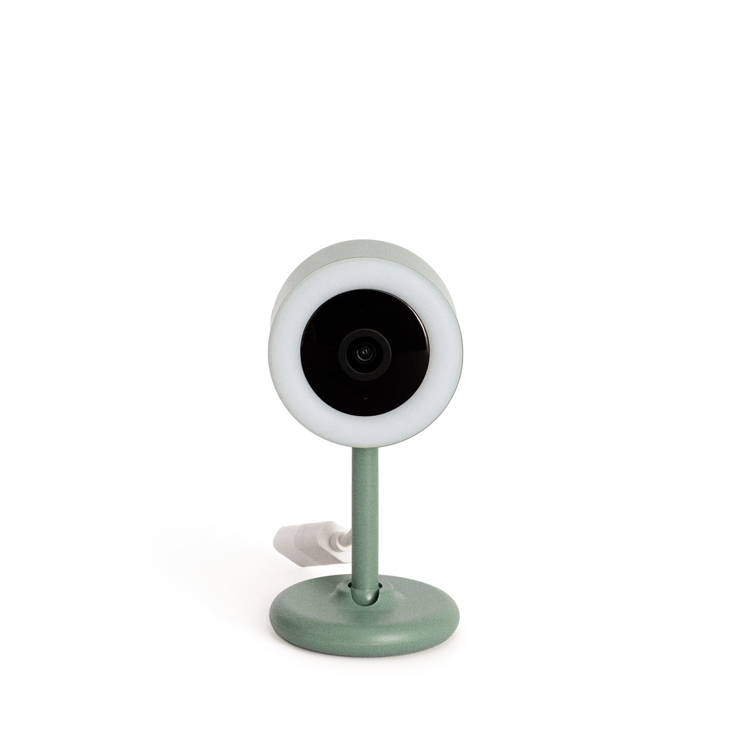Una cámara de seguridad verde con luz circular y cable blanco sobre fondo blanco.