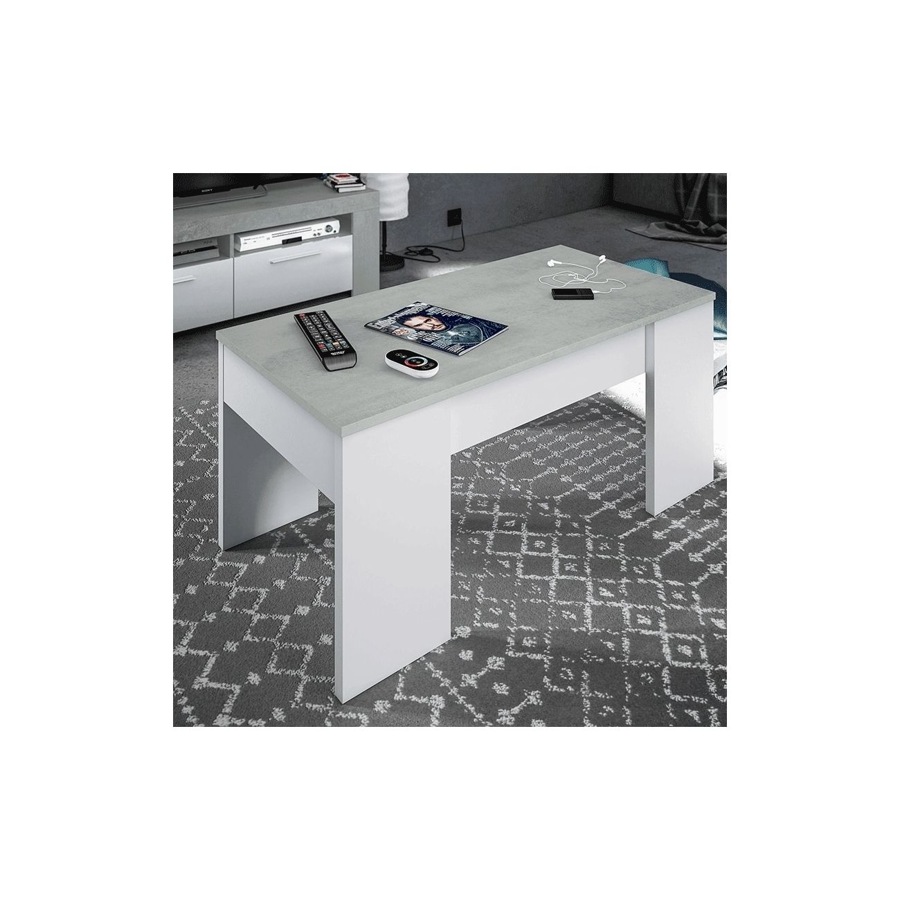 Una mesa moderna blanca con tapa gris, con revista, mandos y auriculares encima.