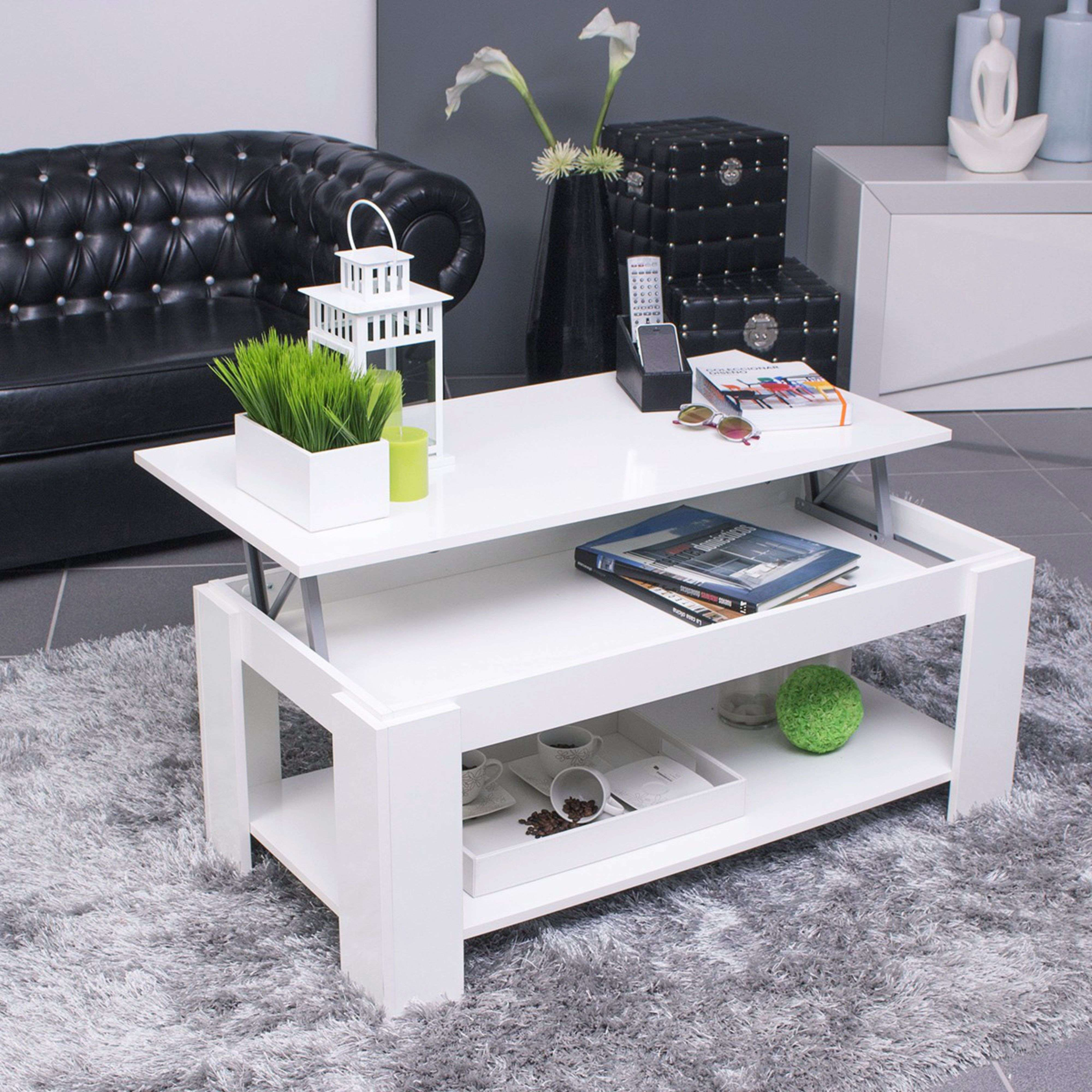 Mesa de centro blanca moderna de dos niveles sobre una alfombra gris.