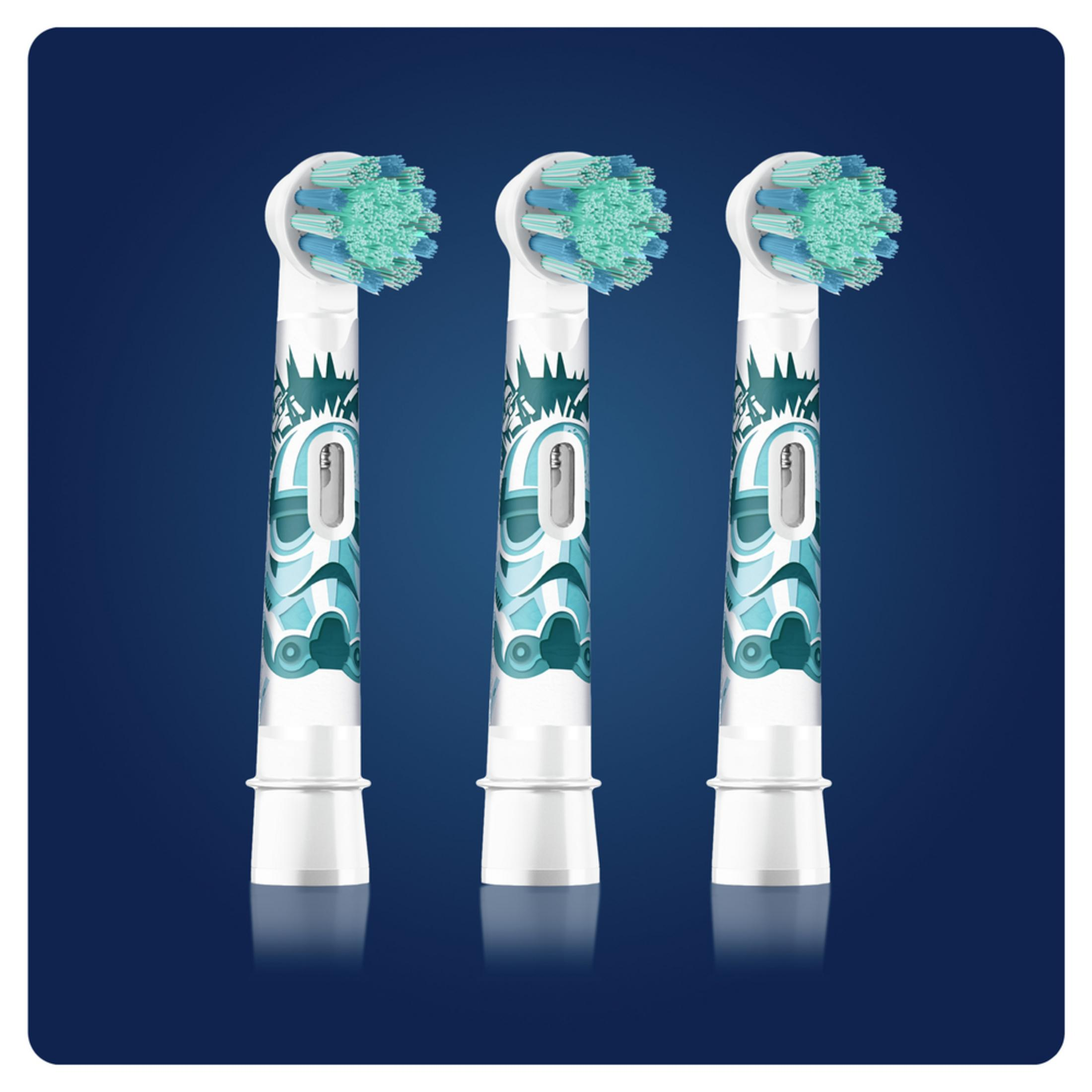 Three white toothbrush heads with teal bristles and stormtrooper design.