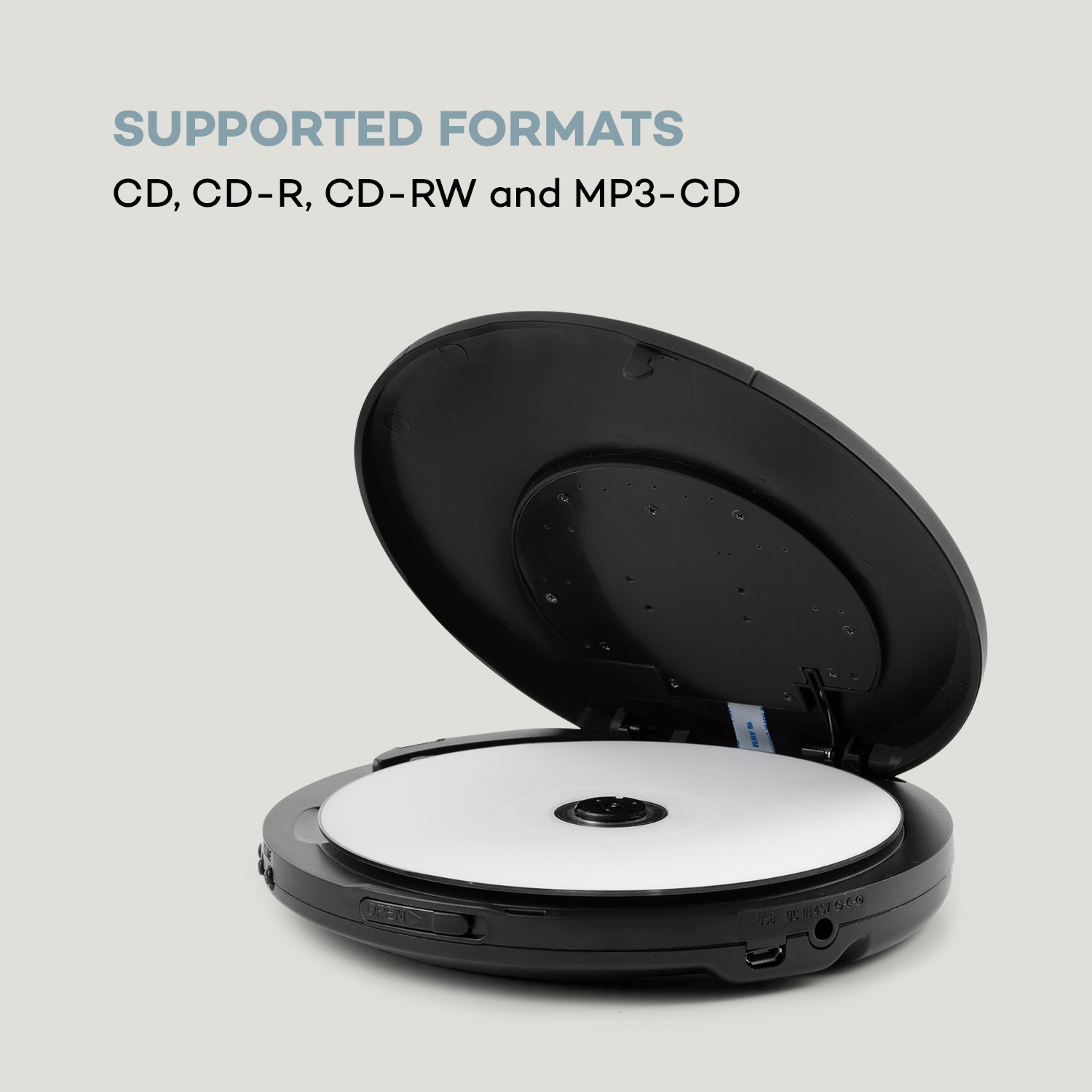 Ein schwarzer tragbarer CD-Player mit geöffnetem Deckel, der eine CD zeigt. Text listet unterstützte Formate auf.