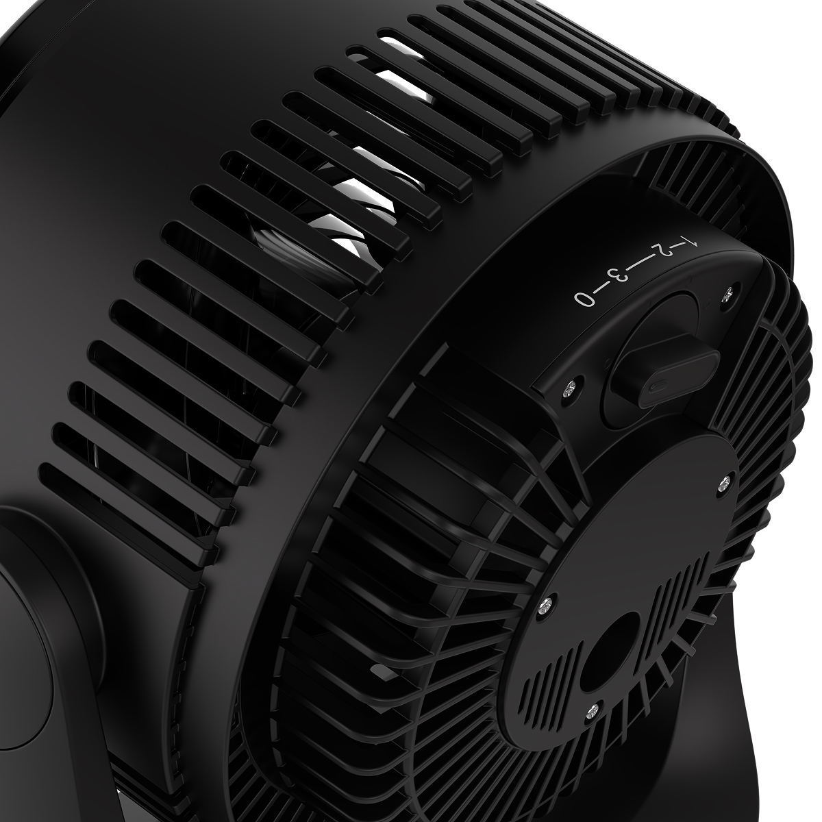 Close-up of a black fan, showing fan blades and speed adjustment dial.
