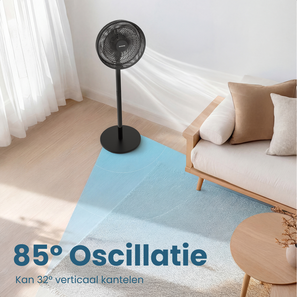 A black standing fan is on a wooden floor, circulating cool air.