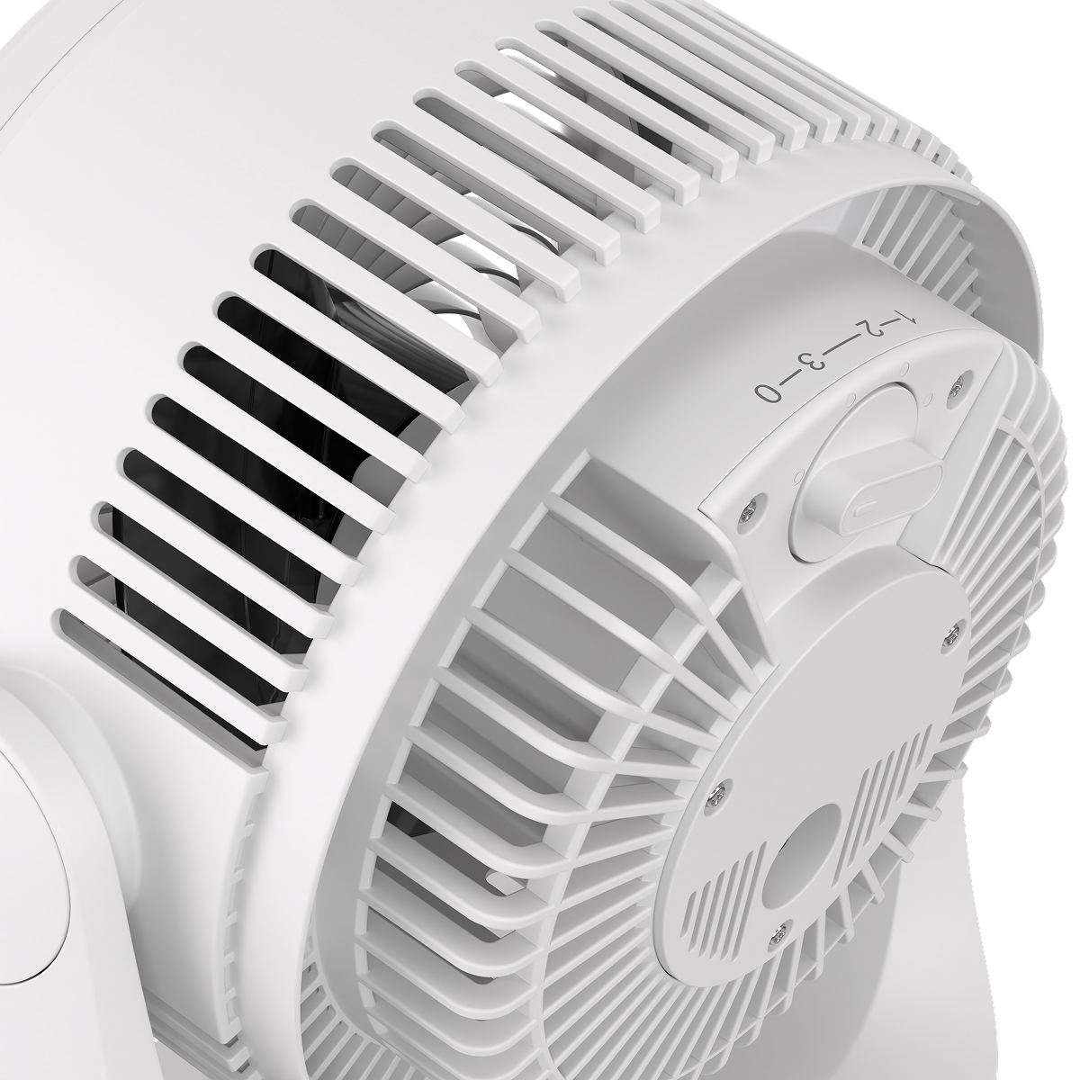 Close-up of a white fan showing blades and control dial with speed settings.