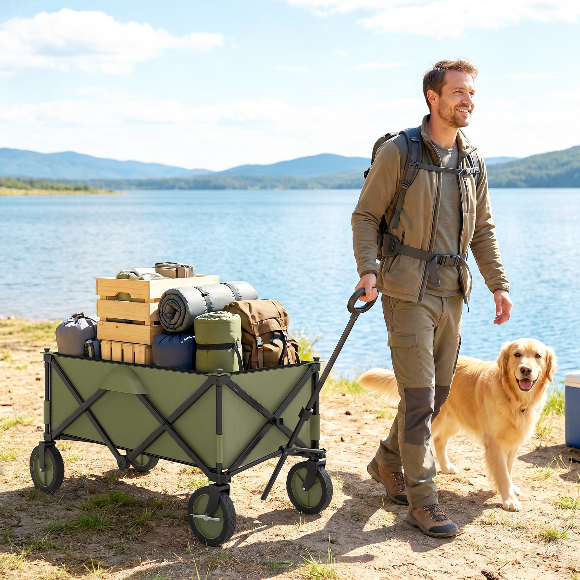 Hombre con perro arrastra carrito de camping junto al lago. Montañas al fondo.