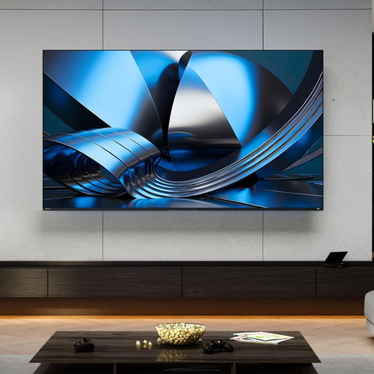 Une TV moderne affiche un graphique 3D abstrait bleu et argenté.
