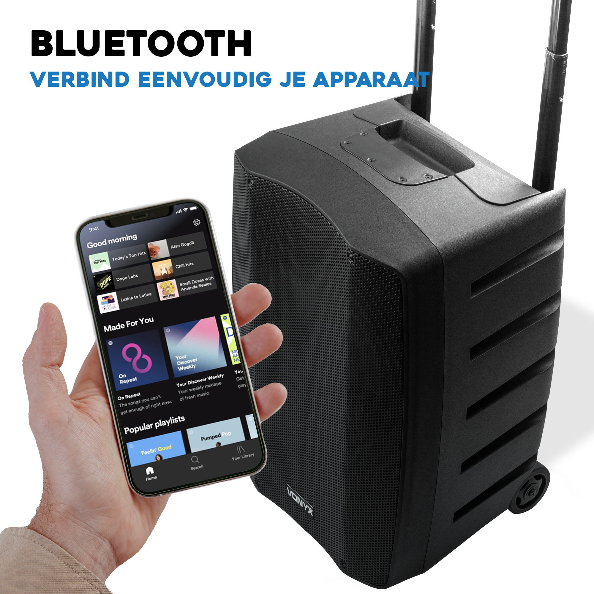Un altavoz Bluetooth negro con ruedas y asa, junto a un teléfono mostrando una aplicación de música.