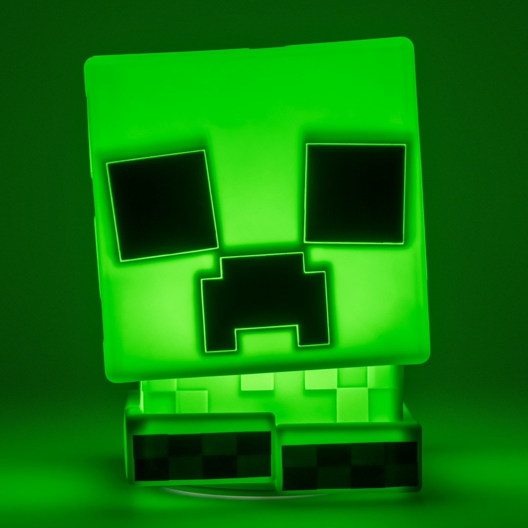 Świecąca zielona lampa Minecraft Creeper z pikselową twarzą.