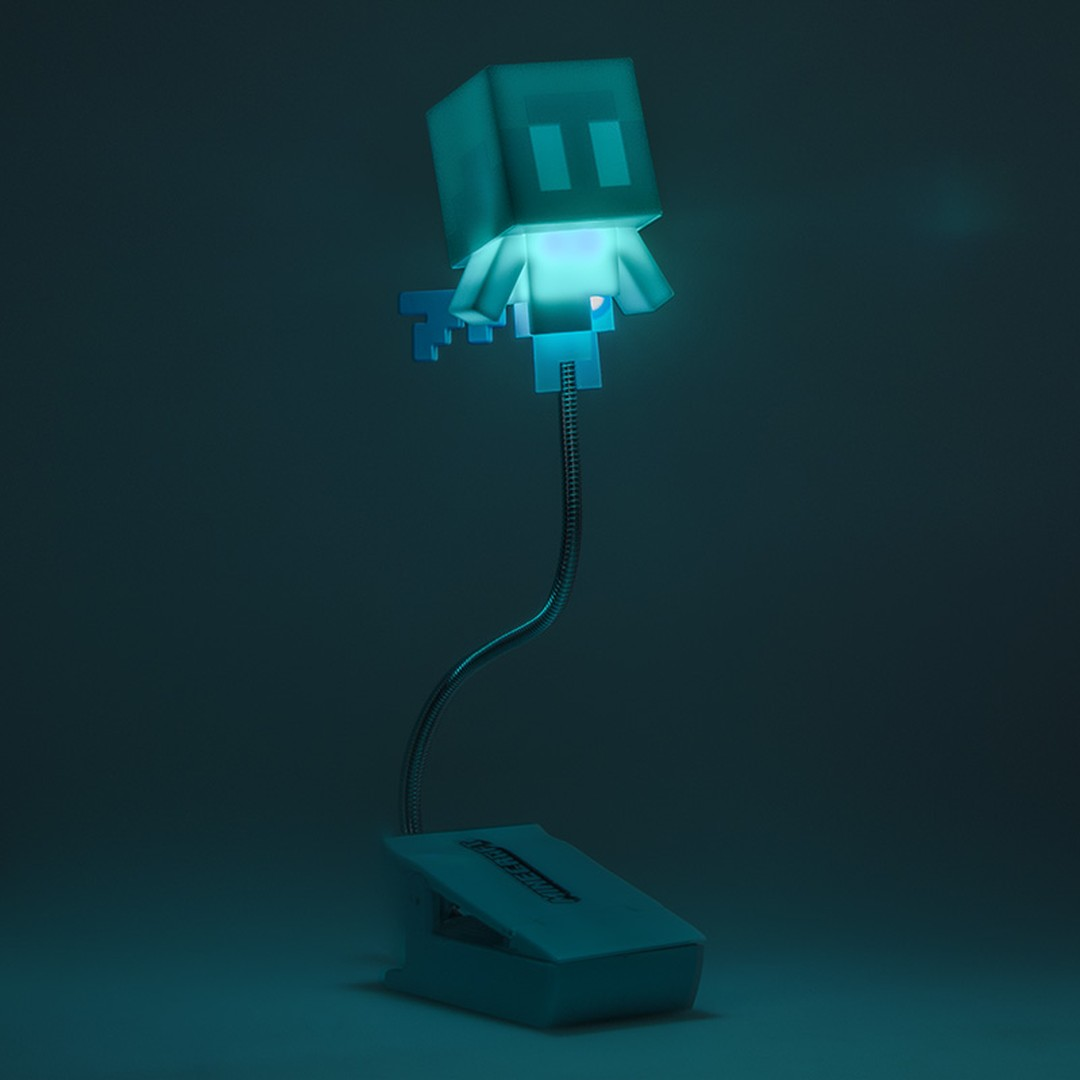 Świecący Minecraft Allay z klipsem u podstawy na ciemnym tle.