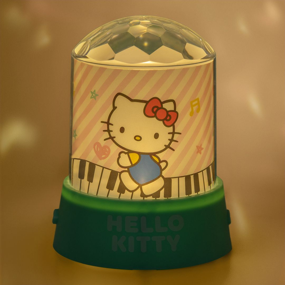 Lampka nocna Hello Kitty z kopułą dyskotekową i motywem klawiatury pianina.
