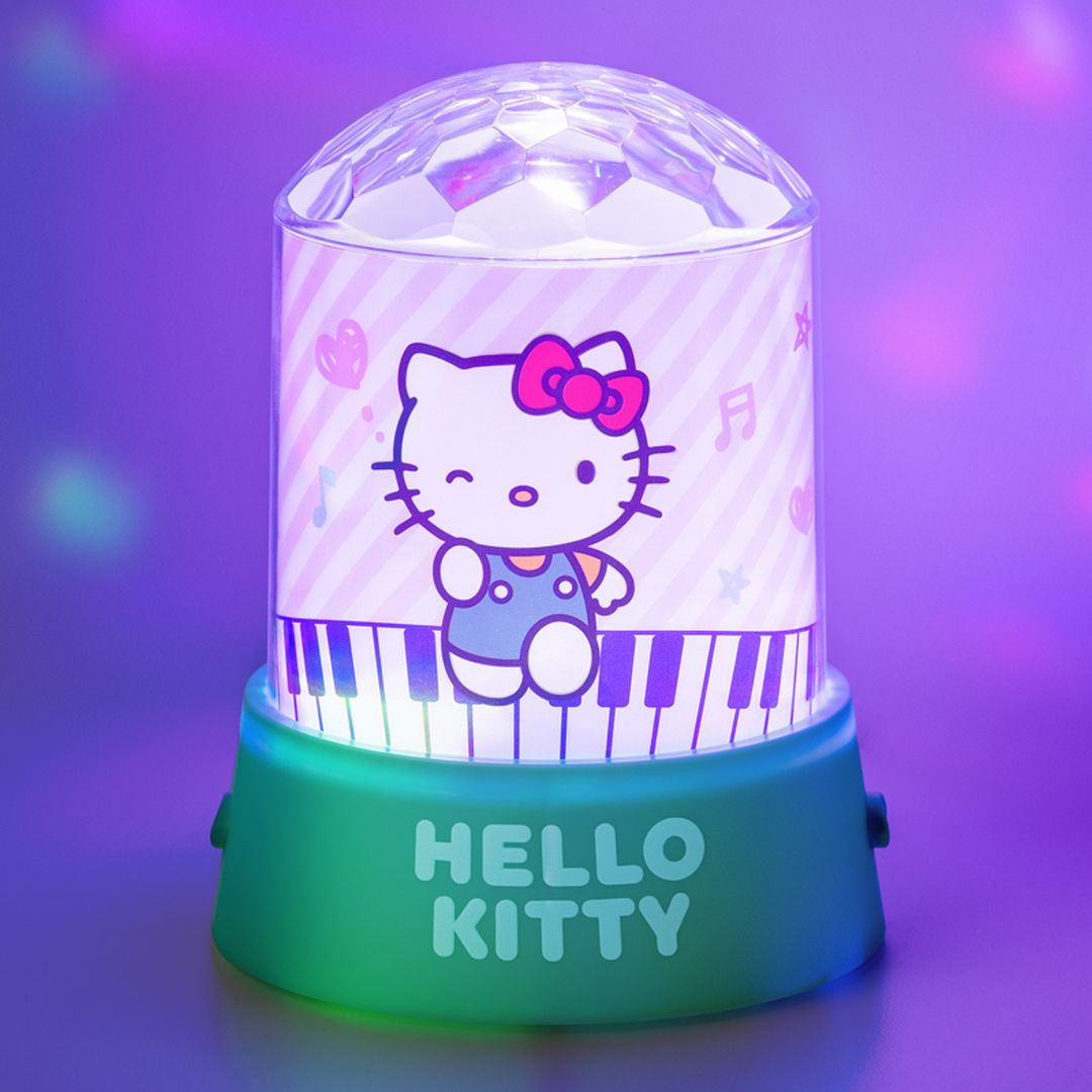Lampa Hello Kitty z kulą dyskotekową, zielona podstawa z klawiszami pianina.