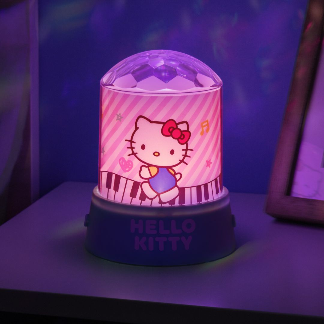 Lampa Hello Kitty z motywem klawiatury pianina, emitująca fioletowe światło.